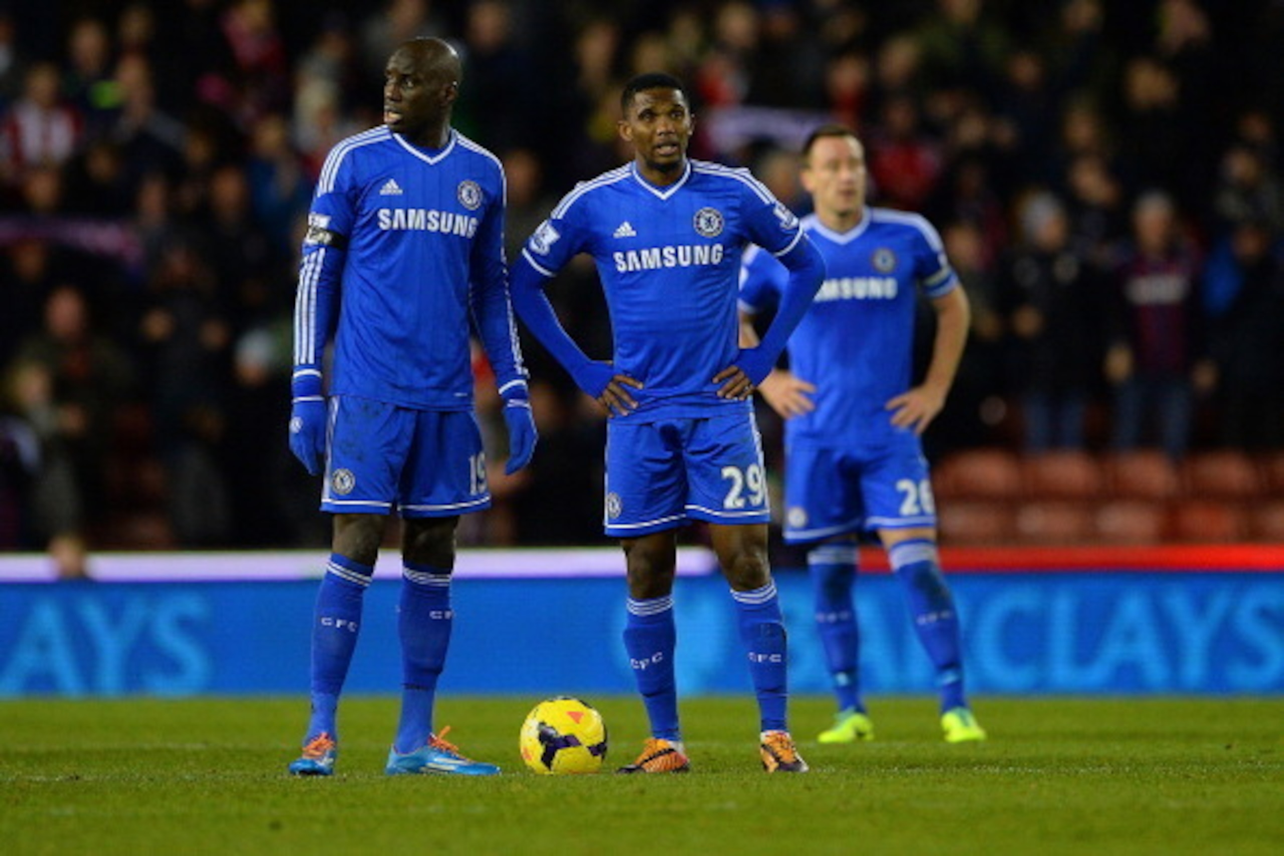 STOKE ON TRENT, ENGLAND - DECEMBER 07:  Dejected Chelsea players Demba Ba, Samuel Eto'o and John Terry react after conceding a third goal  during the Barclays Premier League match between Stoke City and Chelsea at Britannia Stadium on December 7, 2013 in 