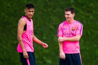 BARCELONA, SPAIN - AUGUST 17: Neymar  (L) and Lionel Messi (R) look on during a FC Barcelona training session at Ciutat Esportiva on August 17, 2014 in Barcelona, Spain.  (Photo by Alex Caparros/Getty Images)