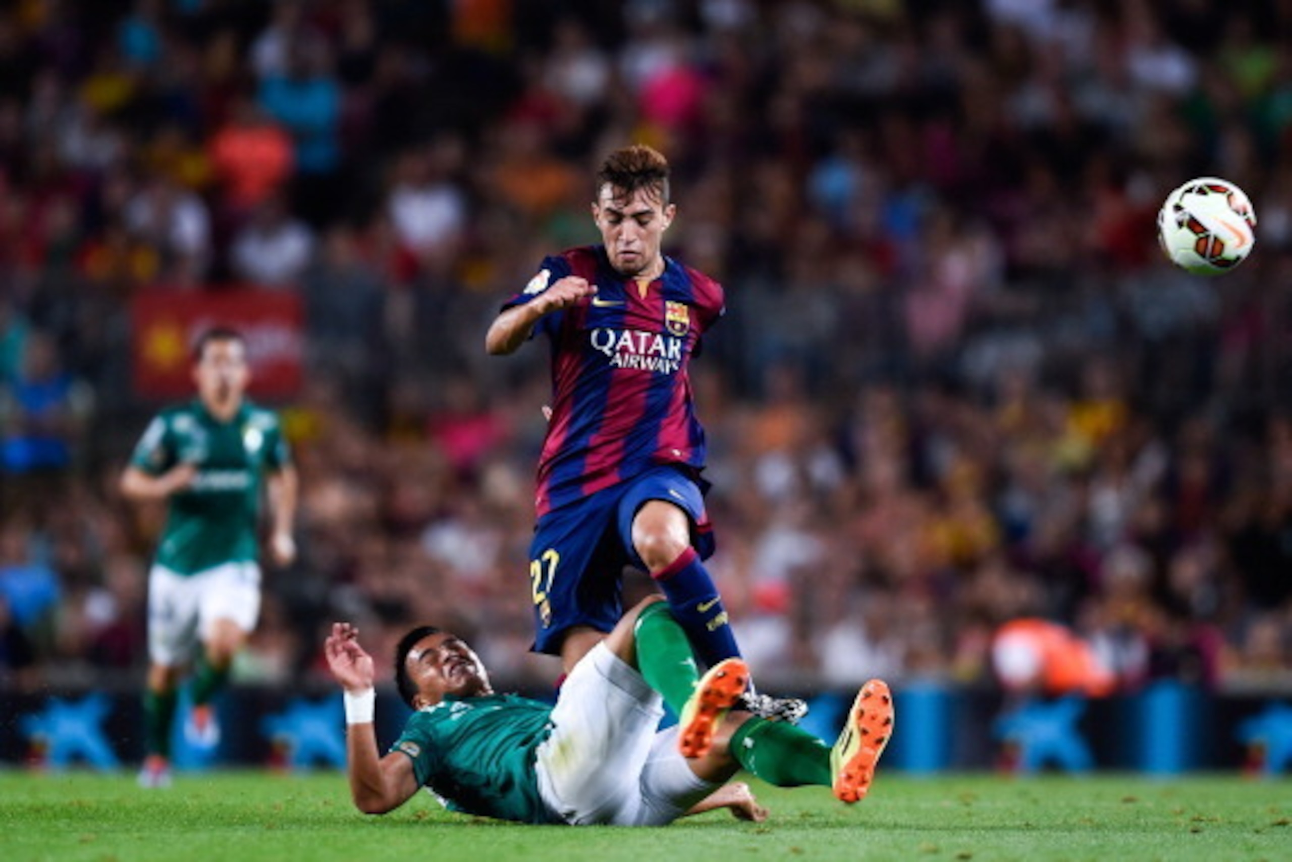 BARCELONA, SPAIN - AUGUST 18: Munir competes for the ball with Jose Juan Vazquez of Club Leon during the Joan Gamper Trophy match between FC Barcelona and Club Leon at Camp Nou on August 18, 2014 in Barcelona, Spain.  (Photo by David Ramos/Getty Images)