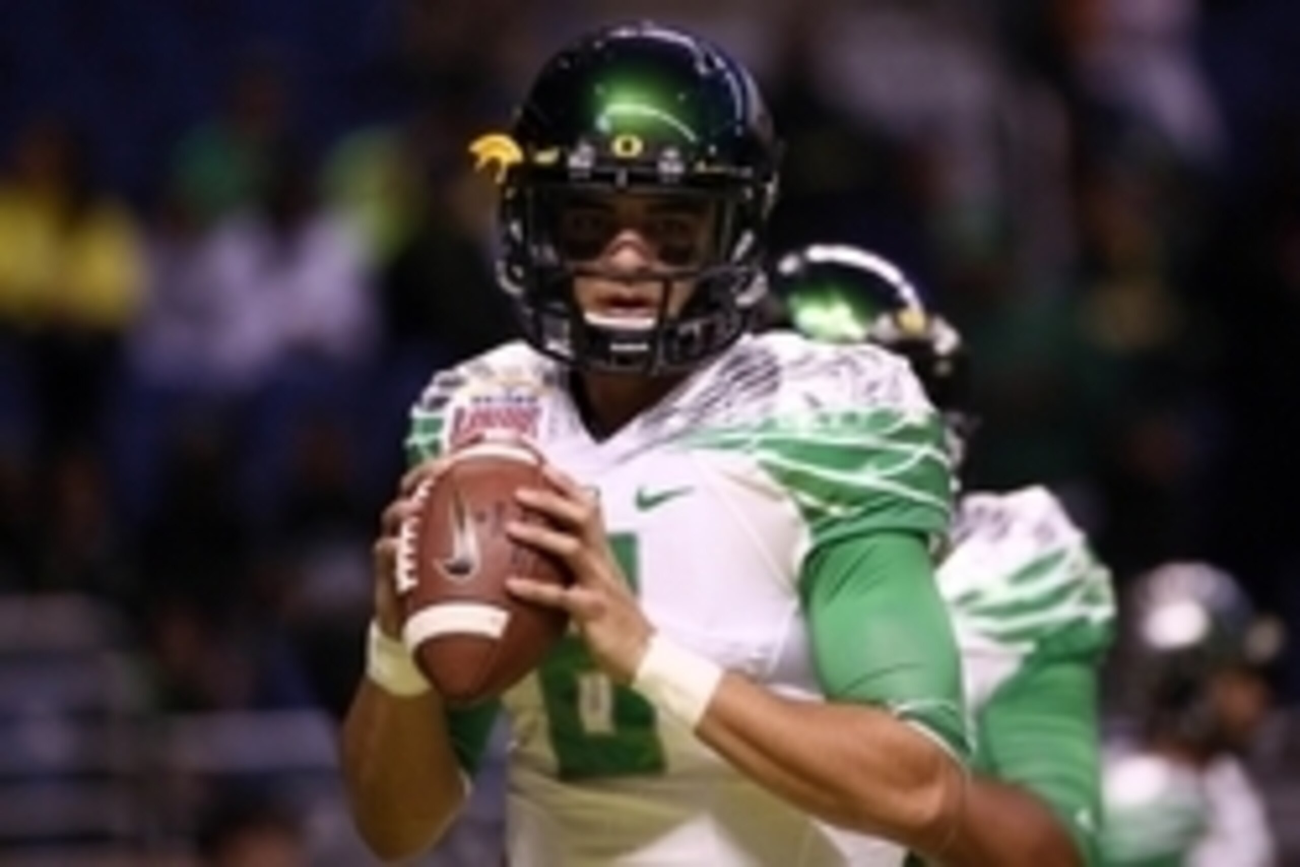 Dec 30, 2013; San Antonio, TX, USA; Oregon Ducks quarterback Marcus Mariota (8) warms up before the game against the Texas Longhorns at Alamo Dome. Mandatory Credit: Soobum Im-USA TODAY Sports