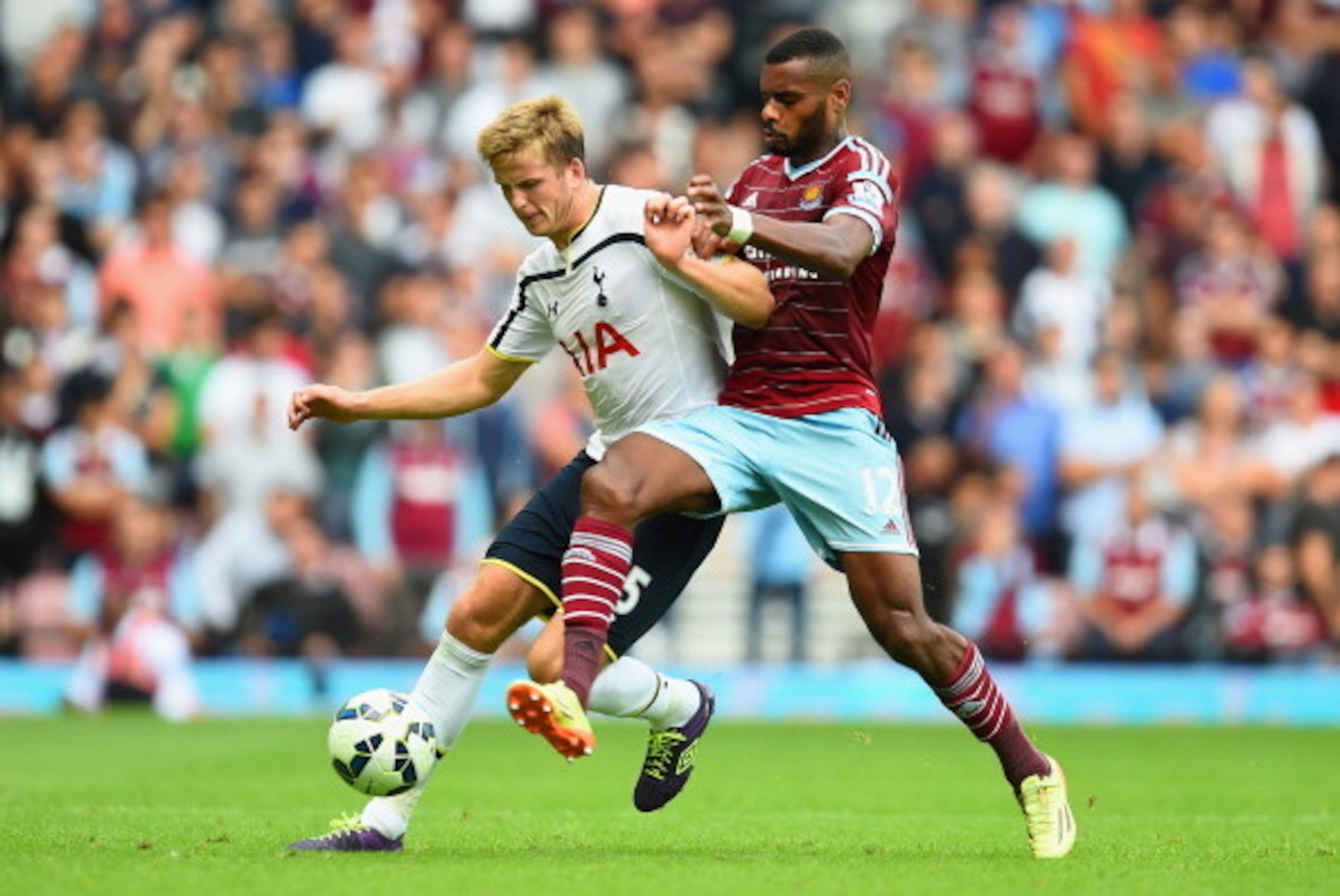 LONDON, ENGLAND - AUGUST 16:  Eric Dier of Spurs holds off the challenge from Ricardo Vaz Te of West Ham during the Barclays Premier League match between West Ham United and Tottenham Hotspur at Boleyn Ground on August 16, 2014 in London, England.  (Photo