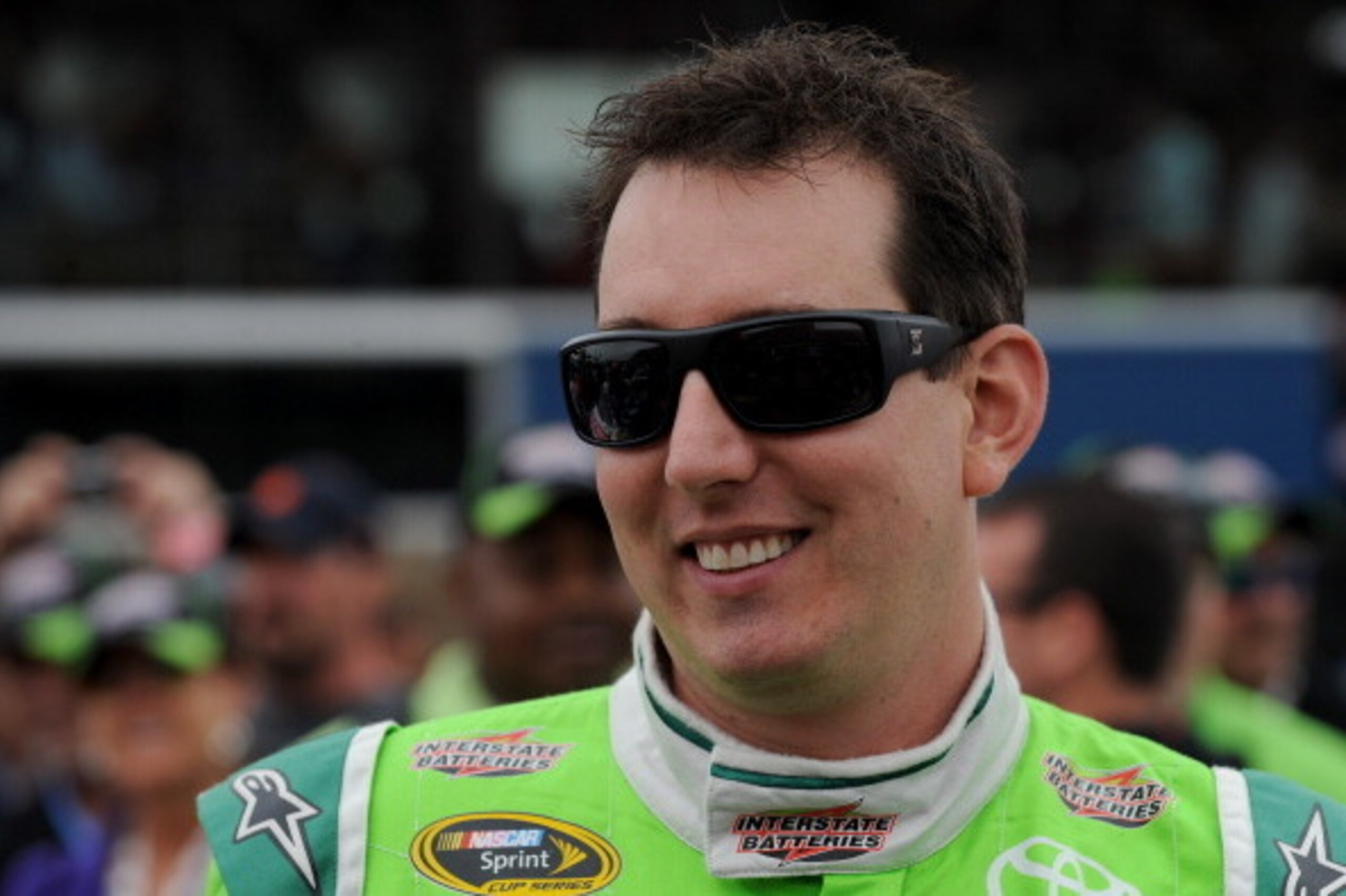 BROOKLYN, MI - AUGUST 17:  Kyle Busch, driver of the #18 Interstate Batteries Toyota, stands on the grid prior to the NASCAR Sprint Cup Series Pure Michigan 400 at Michigan International Speedway on August 17, 2014 in Brooklyn, Michigan.  (Photo by Robert