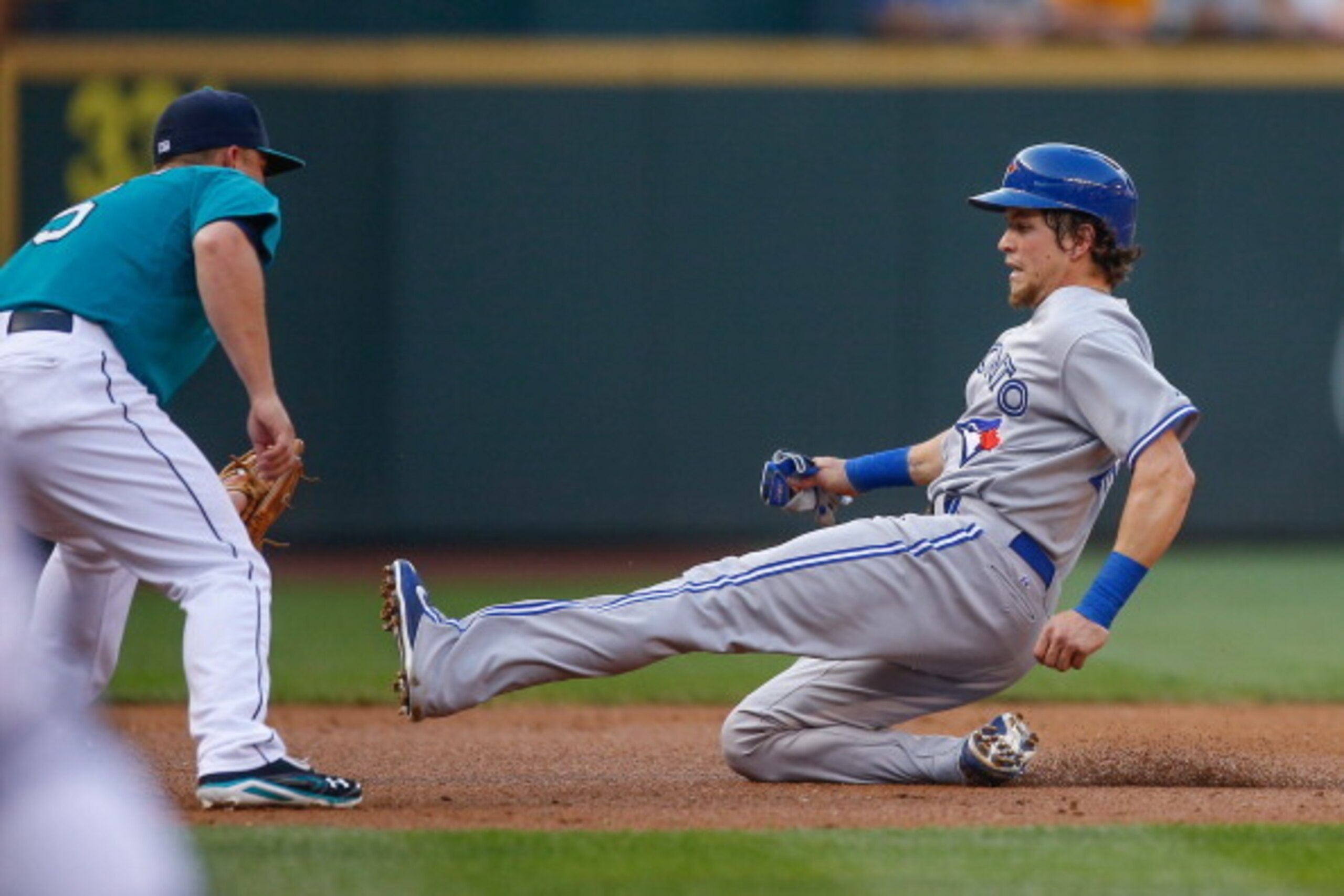 SEATTLE, WA - AUGUST 11:  Colby Rasmus #28 of the Toronto Blue Jays is tagged out by third baseman Kyle Seager #15 of the Seattle Mariners on a fielders choice play in the second inning at Safeco Field on August 11, 2014 in Seattle, Washington.  (Photo by