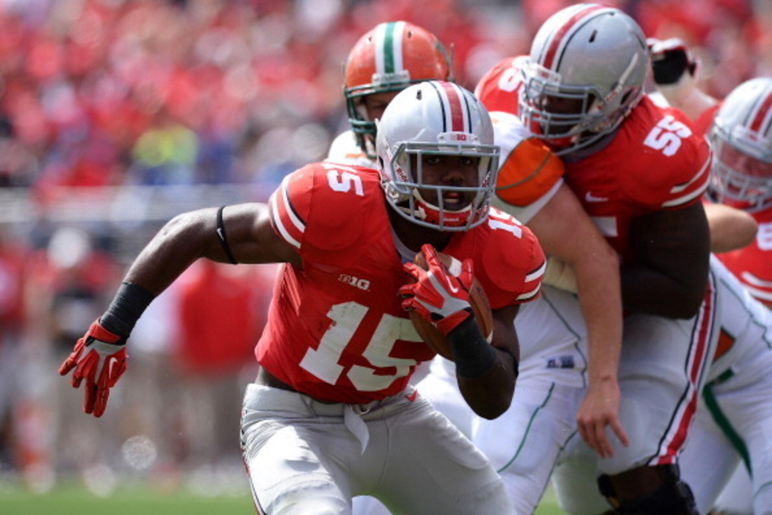 COLUMBUS, OH - SEPTEMBER 21: Ezekiel Elliott #15 of the Ohio State Buckeyes looks for running room as he picks up yardage against the Florida A&M Rattlers in the third quarter at Ohio Stadium on September 21, 2013 in Columbus, Ohio. Ohio State defeated F COLUMBUS, OH - SEPTEMBER 21: Ezekiel Elliott #15 of the Ohio State Buckeyes looks for running room as he picks up yardage against the Florida A&M Rattlers in the third quarter at Ohio Stadium on September 21, 2013 in Columbus, Ohio. Ohio State defeated F