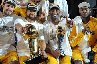 LOS ANGELES - JUNE 17: Sasha Vujacic #18, Derek Fisher #2, Kobe Bryant #24, Lamar Odom #7, and Josh Powell #21 of the Los Angeles Lakers celebrates after defeating the Boston Celtics 83-79 in Game Seven of the 2010 NBA Finals on June 17, 2010 at Staples C