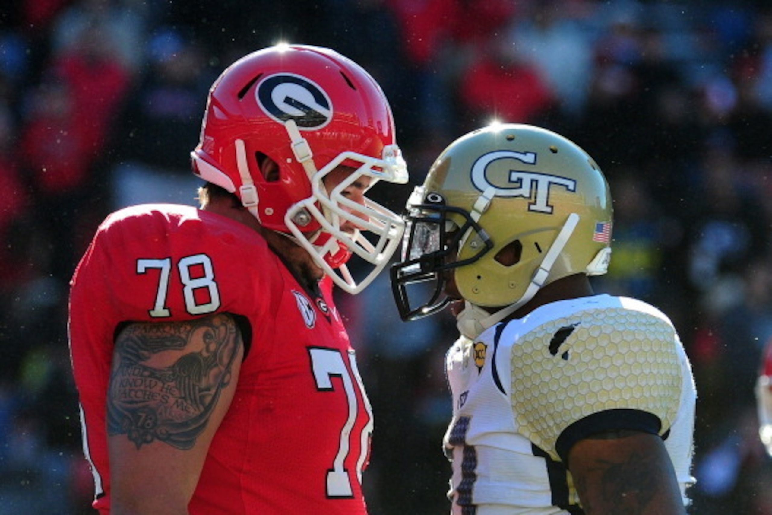ATHENS, GA - NOVEMBER 24: Watts Dantzler #78 of the Georgia Bulldogs walks past Brandon Watts #11 of the Georgia Tech Yellow Jackets at Sanford Stadium on November 24, 2012 in Athens, Georgia. (Photo by Scott Cunningham/Getty Images)