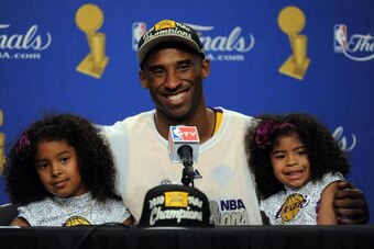 LOS ANGELES, CA - JUNE 17:  Kobe Bryant #24 of the Los Angeles Lakers speaks during the post game news conference with daughters Natalia and Gianna Bryant as he celebrates after the Lakers defeated the Boston Celtics 83-79 in Game Seven of the 2010 NBA Fi