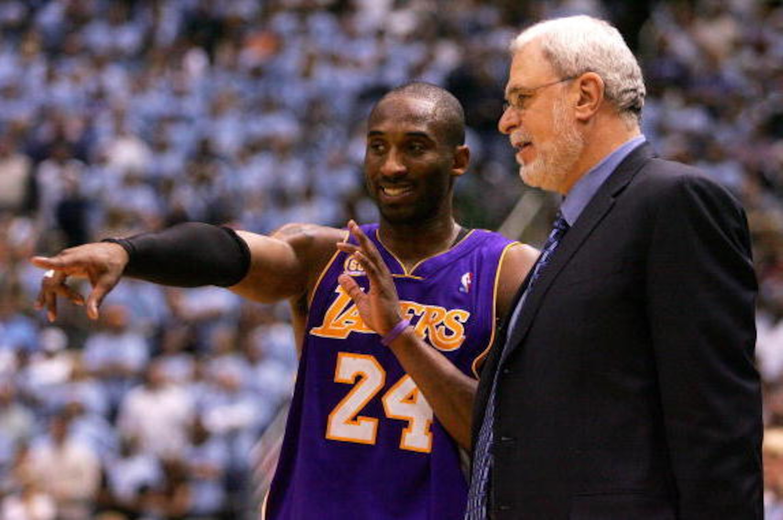 SALT LAKE CITY - MAY 09:  Kobe Bryant #24 of the Los Angeles Lakers talks with Head Coach Phil Jackson against the Utah Jazz in Game Three of the Western Conference Semifinals during the 2008 NBA Playoffs on May 9, 2008 at Energy Solutions Arena in Salt L