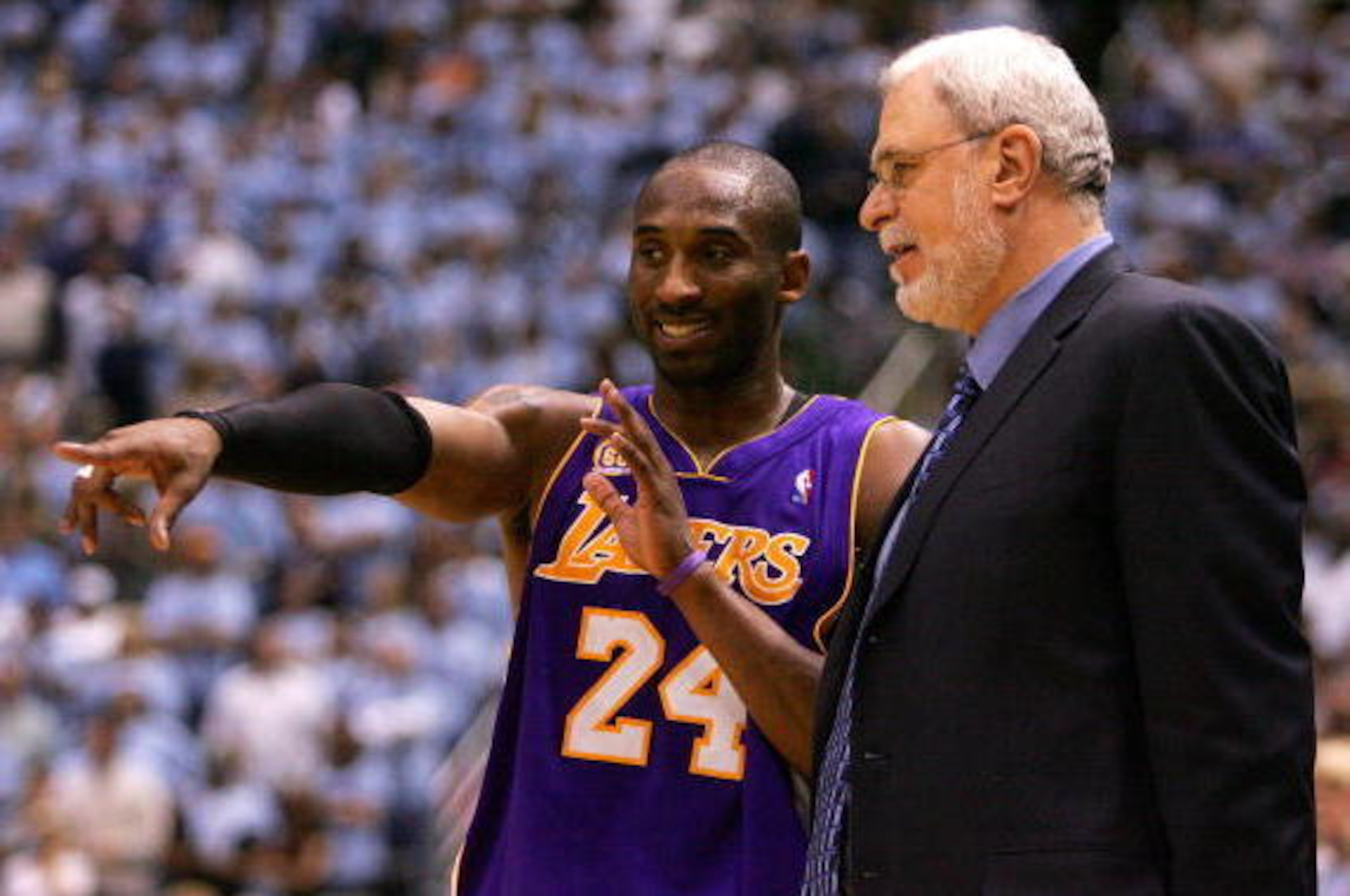 SALT LAKE CITY - MAY 09: Kobe Bryant #24 of the Los Angeles Lakers talks with Head Coach Phil Jackson against the Utah Jazz in Game Three of the Western Conference Semifinals during the 2008 NBA Playoffs on May 9, 2008 at Energy Solutions Arena in Salt L SALT LAKE CITY - MAY 09: Kobe Bryant #24 of the Los Angeles Lakers talks with Head Coach Phil Jackson against the Utah Jazz in Game Three of the Western Conference Semifinals during the 2008 NBA Playoffs on May 9, 2008 at Energy Solutions Arena in Salt L