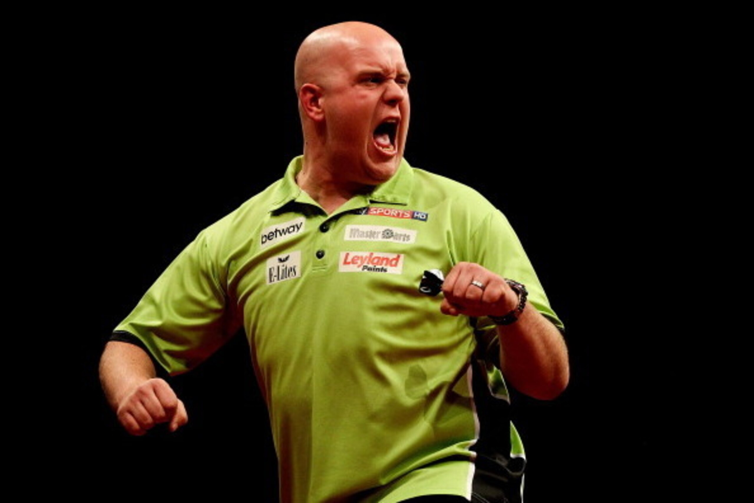 LONDON, ENGLAND - MAY 22: Michael van Gerwen of the Netherlands celebrates winning a leg during the McCoys Premier League Darts Play-Offs Semi Final match between Michael van Gerwen and Gary Anderson at O2 Arena on May 22, 2014 in London, England.  (Photo