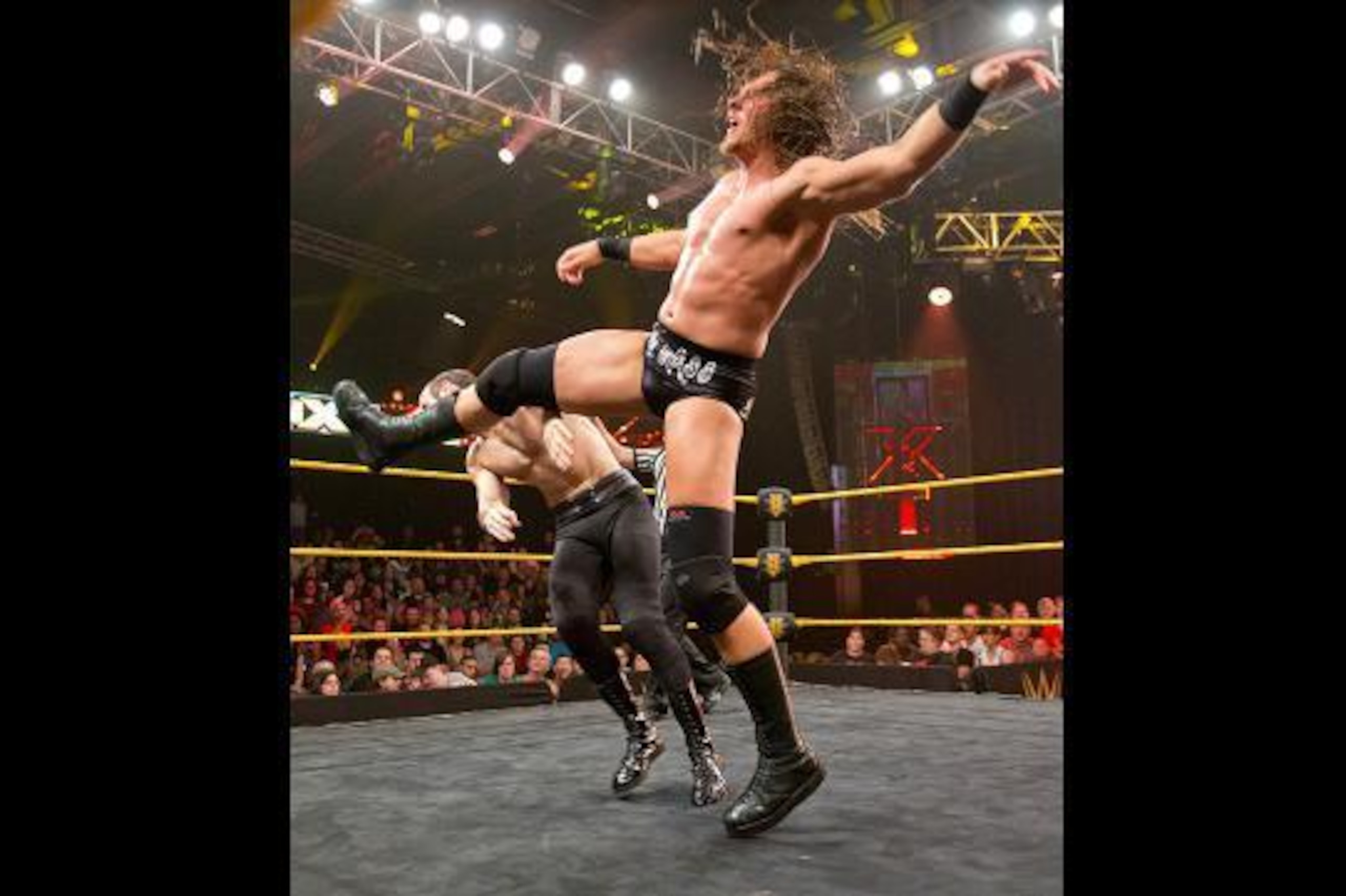 Colin Cassady kicks Aiden English.