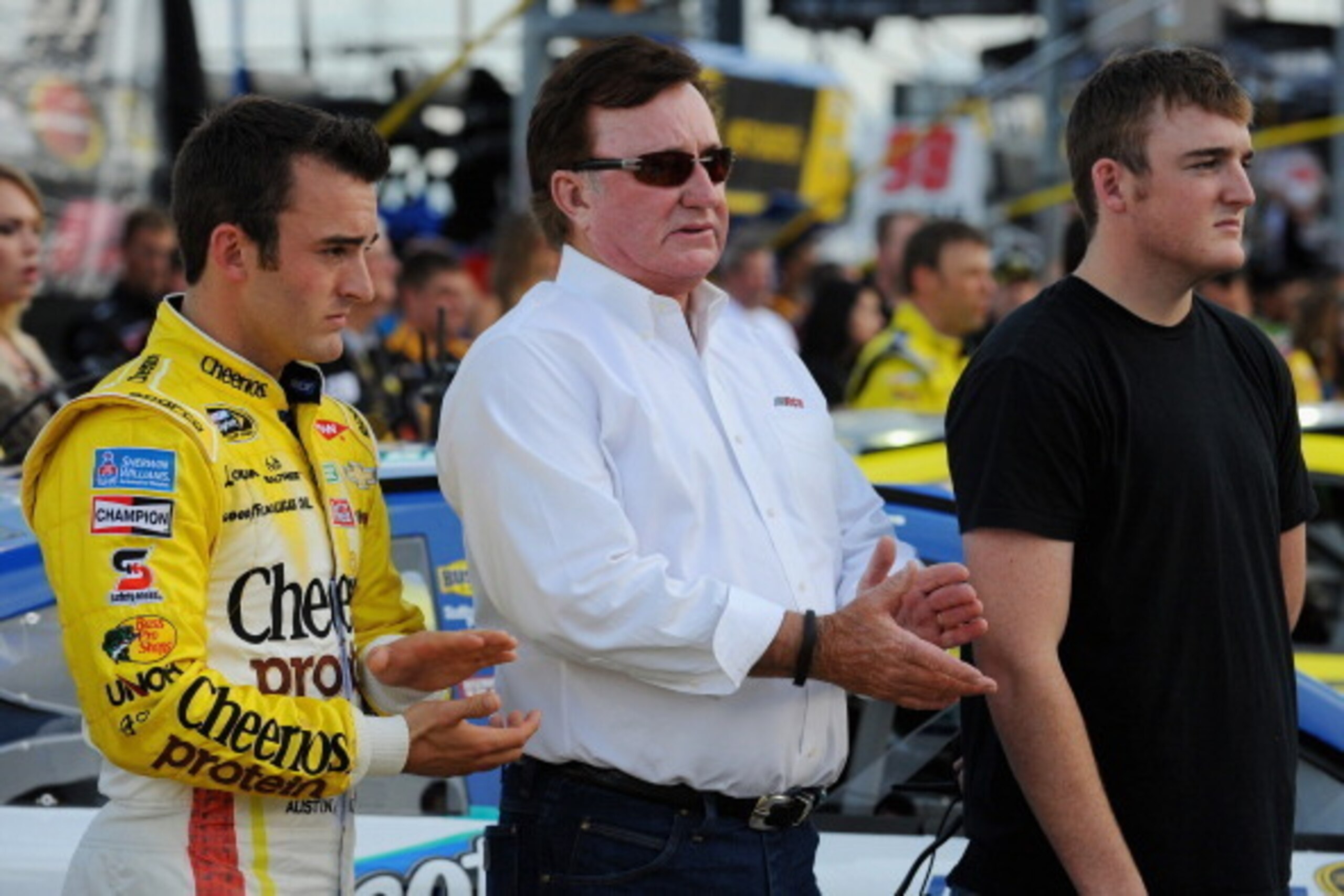 SPARTA, KY - JUNE 28:  Austin Dillon, driver of the #3 Cheerios Protein Chevrolet, owner and grandfather Richard Childress and brother Ty Dillon take part in pre-race ceremonies for the NASCAR Sprint Cup Series Quaker State 400 presented by Advance Auto P