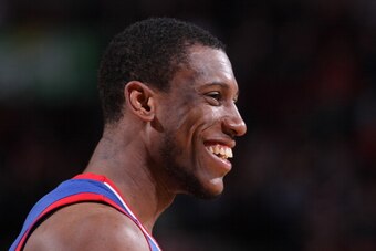 PORTLAND, OR - JANUARY 4:  Thaddeus Young #21 of the Philadelphia 76ers smiles against the Portland Trail Blazers on January 4, 2014 at the Moda Center Arena in Portland, Oregon. NOTE TO USER: User expressly acknowledges and agrees that, by downloading an