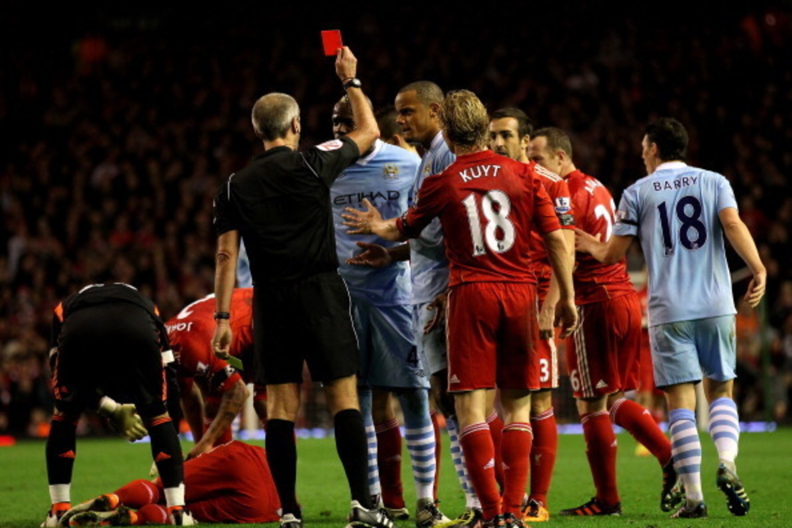 LIVERPOOL, ENGLAND - NOVEMBER 27:  Mario Balotelli of Manchester City is shown a red card by Referee Martin Atkinson during the Barclays Premier League match between Liverpool and Manchester City at Anfield on November 27, 2011 in Liverpool, England.  (Ph