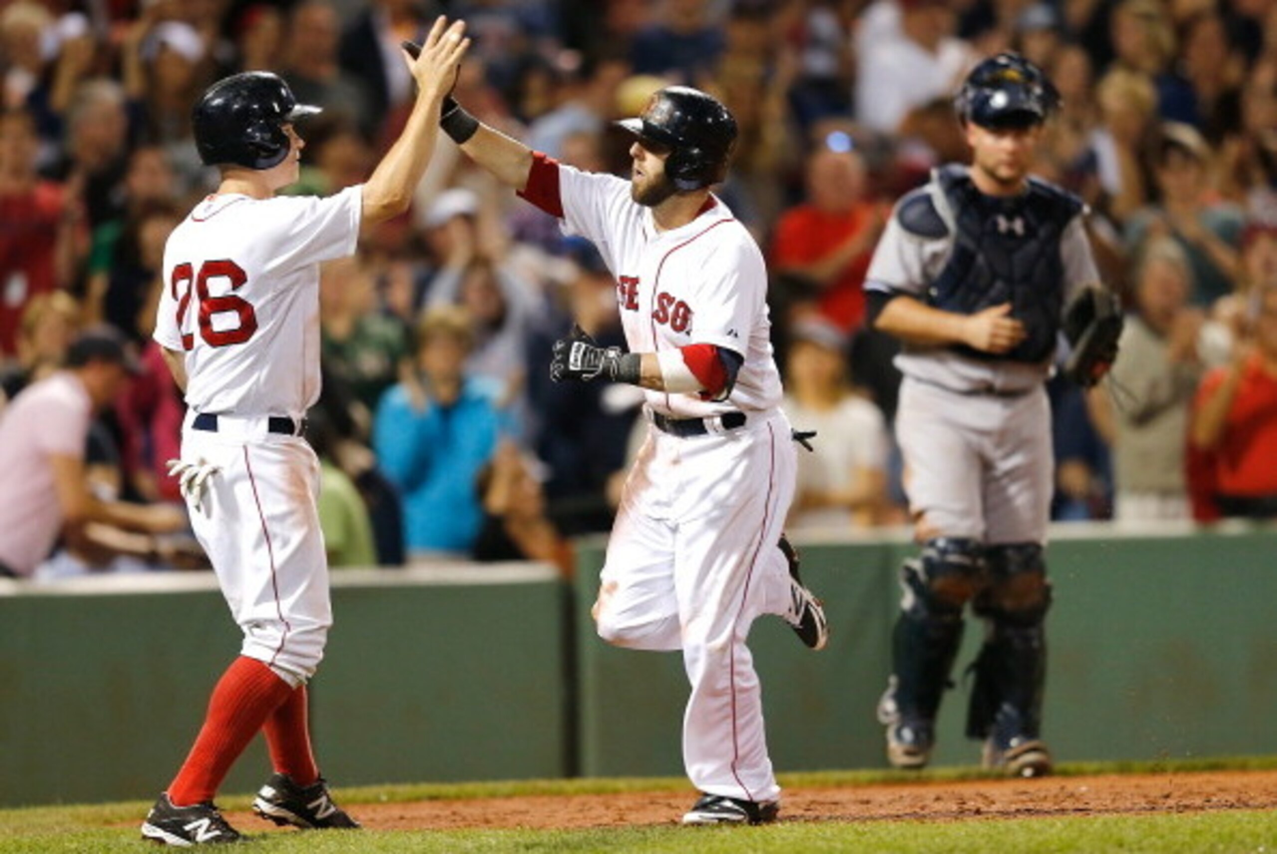 BOSTON, MA - AUGUST 3: Dustin Pedroia #15 of the Boston Red Sox celebrates his home run with teammate Brock Holt #26 as Brian McCann #34 of the New York Yankees watches in the second inning against at Fenway Park on August 3, 2014 in Boston, Massachuse BOSTON, MA - AUGUST 3: Dustin Pedroia #15 of the Boston Red Sox celebrates his home run with teammate Brock Holt #26 as Brian McCann #34 of the New York Yankees watches in the second inning against at Fenway Park on August 3, 2014 in Boston, Massachuse