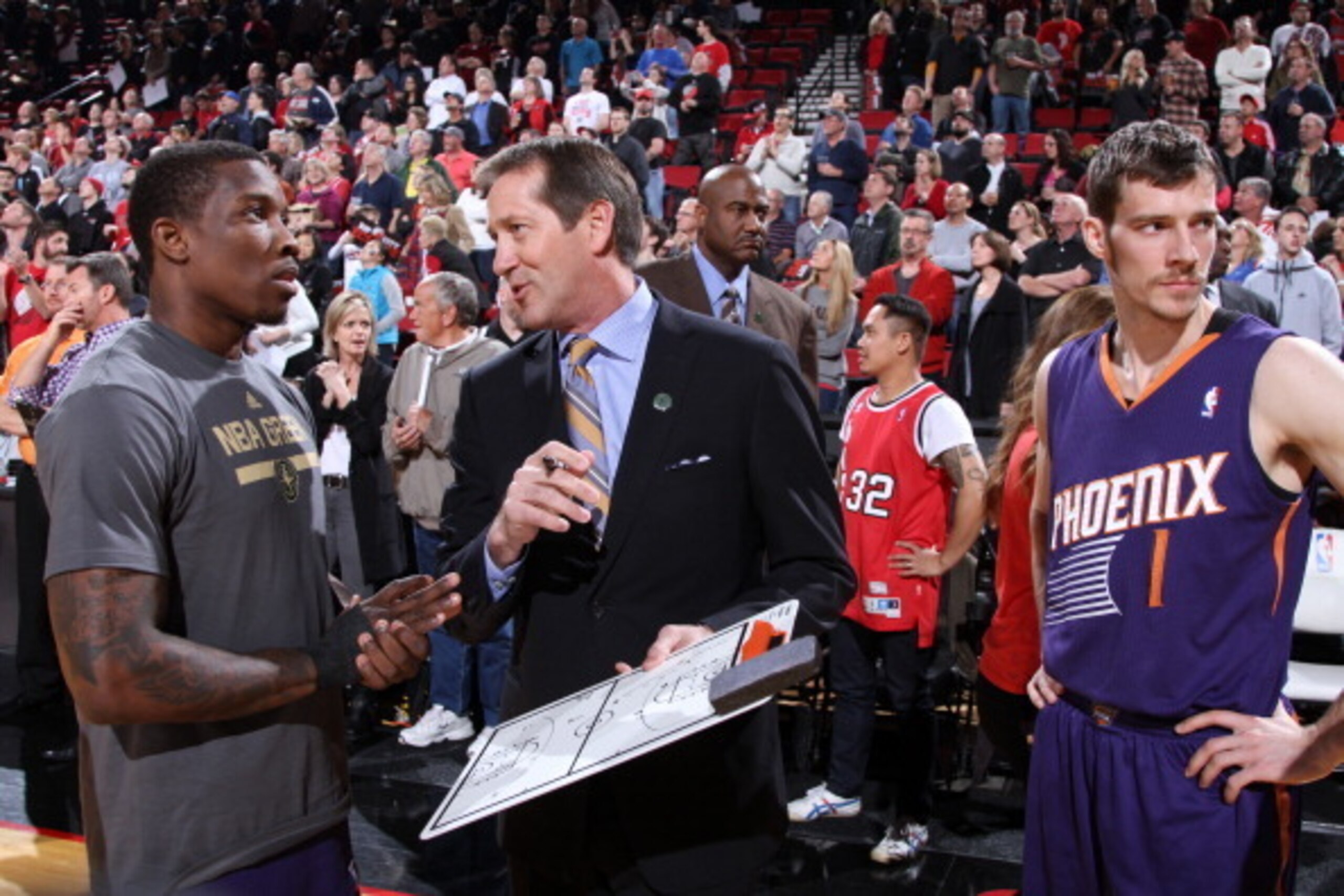 PORTLAND, OR - APRIL 4:  Jeff Hornacek of the Phoenix Suns speaks with Eric Bledsoe #2 before the game against the Portland Trail Blazers on April 4, 2014 at the Moda Center Arena in Portland, Oregon. NOTE TO USER: User expressly acknowledges and agrees t