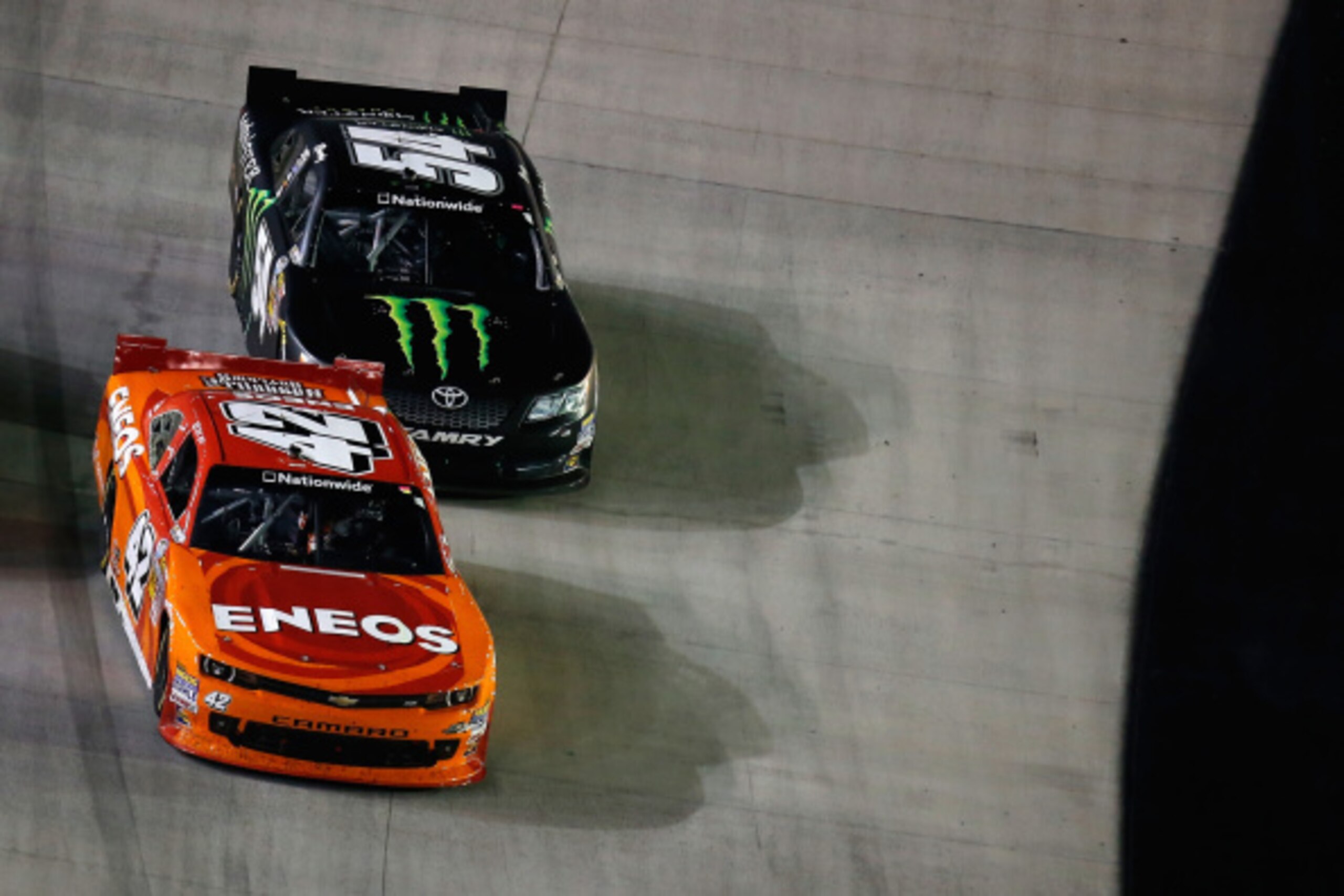 BRISTOL, TN - AUGUST 22:  Kyle Larson, driver of the #42 ENEOS Chevrolet, leads Kyle Busch, driver of the #54 Monster Energy Toyota, during the NASCAR Nationwide Series Food City 300 at Bristol Motor Speedway on August 22, 2014 in Bristol, Tennessee.  (Ph