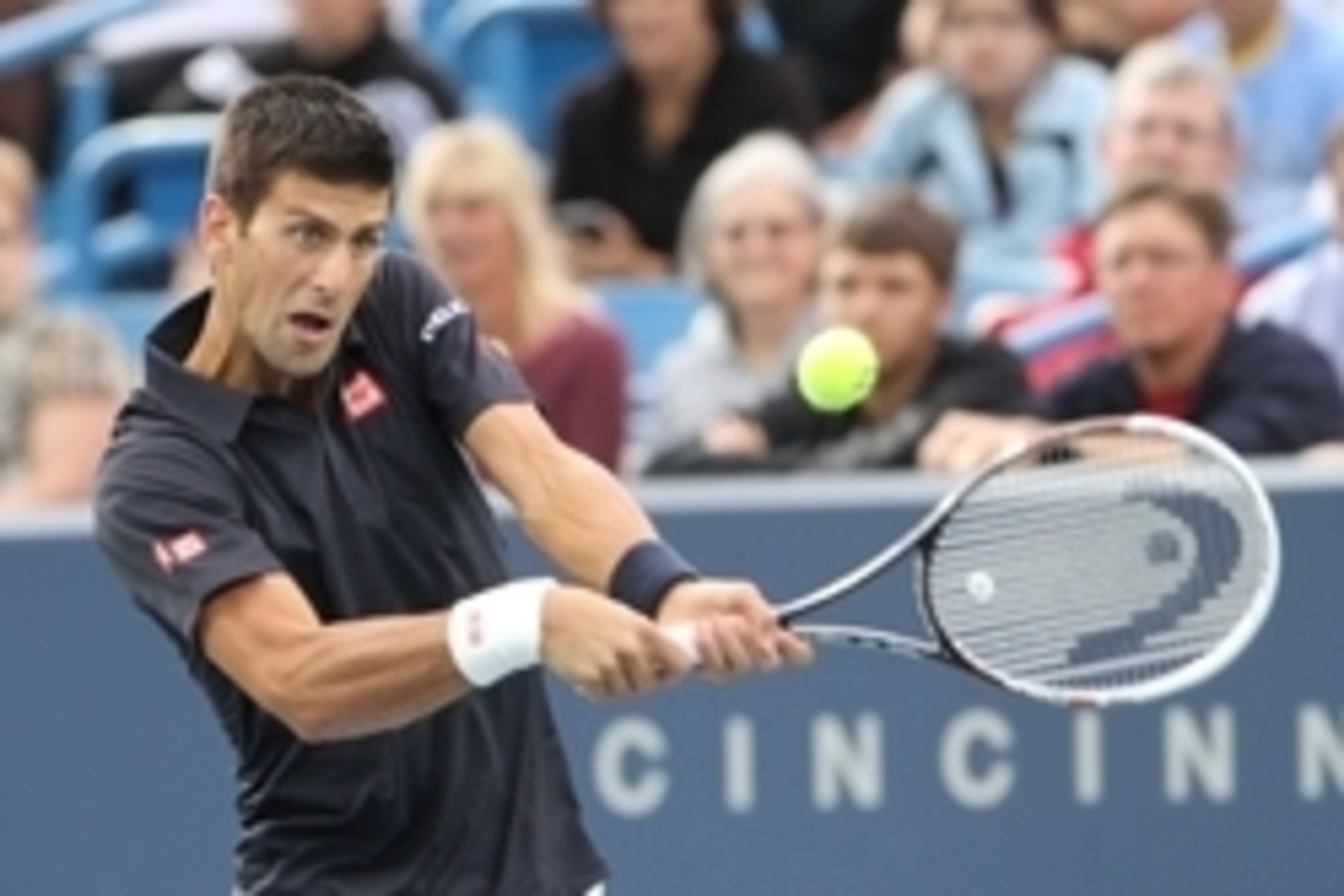 Aug 12, 2014; Cincinnati, OH, USA; Novak Djokovic returns the serve of Gilles Simon on day two of the Western and Southern Open tennis tournament at Linder Family Tennis Center. Mandatory Credit: Mark Zerof-USA TODAY Sports Aug 12, 2014; Cincinnati, OH, USA; Novak Djokovic returns the serve of Gilles Simon on day two of the Western and Southern Open tennis tournament at Linder Family Tennis Center. Mandatory Credit: Mark Zerof-USA TODAY Sports