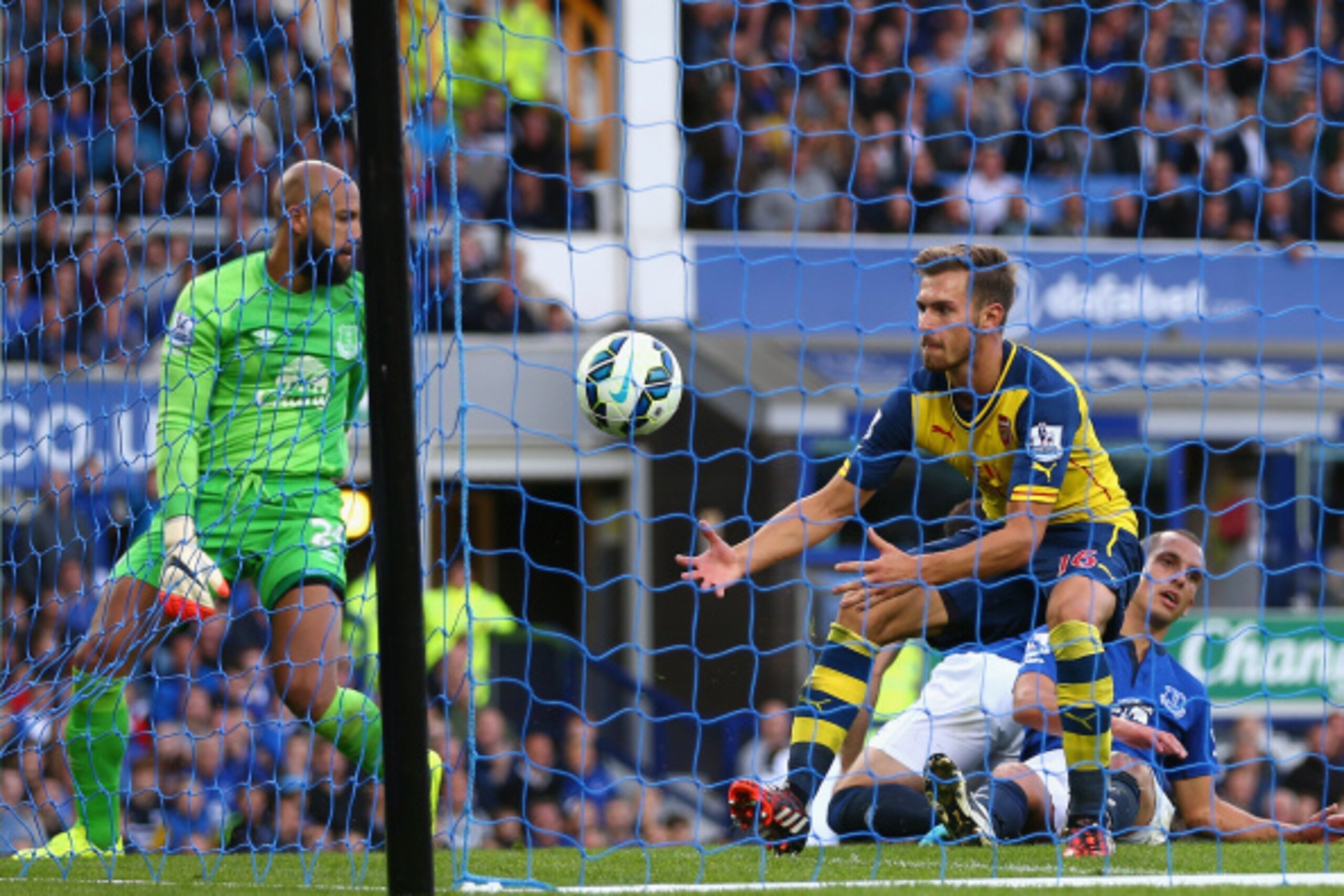 LIVERPOOL, ENGLAND - AUGUST 23:  Aaron Ramsey of Arsenal reacts after scoring his team's first goal during the Barclays Premier League match between Everton and Arsenal at Goodison Park on August 23, 2014 in Liverpool, England.  (Photo by Clive Brunskill/