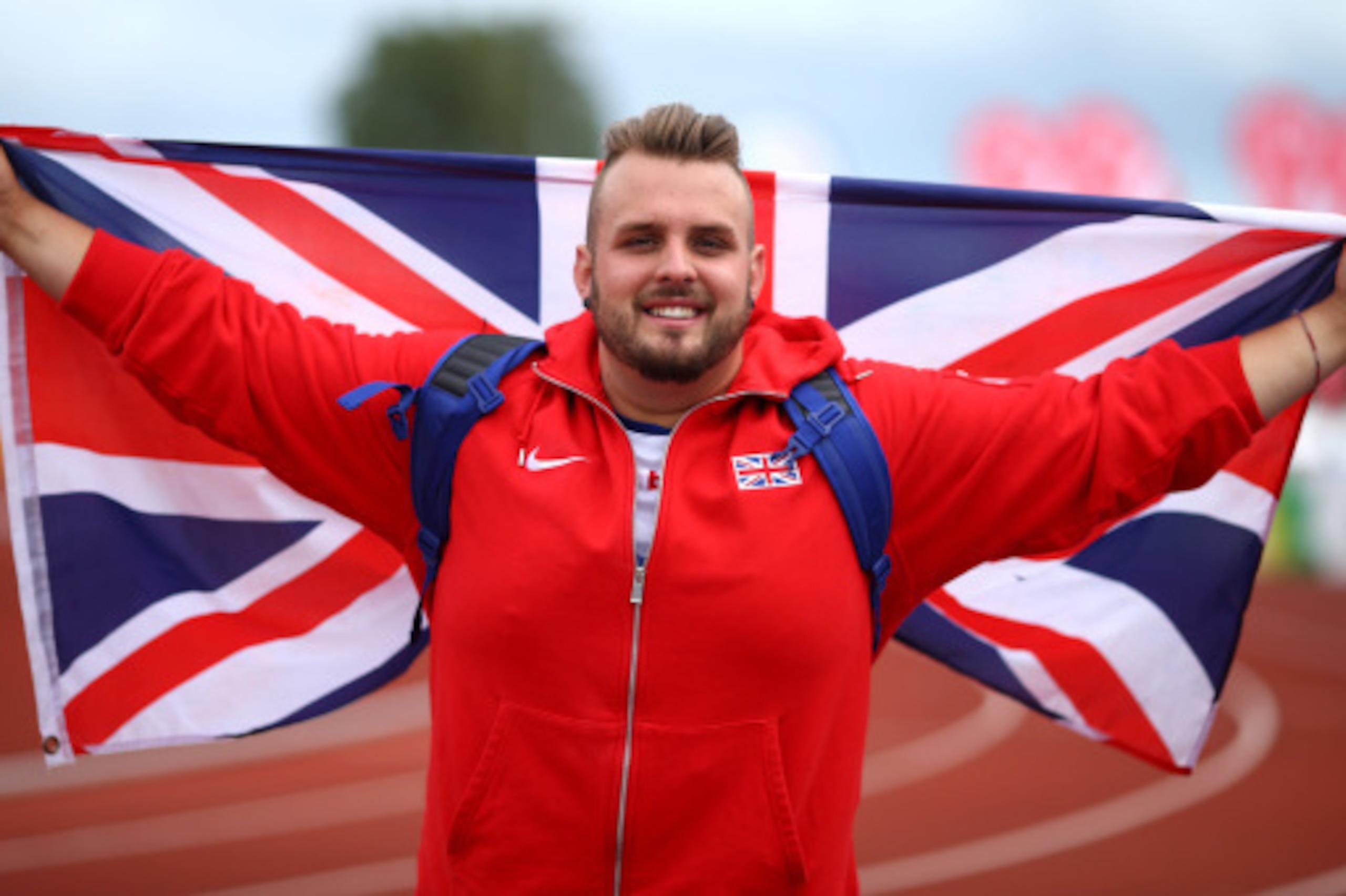 SWANSEA, WALES - AUGUST 21: Aled Davies of Great Britain celebrates winning the mens shot put F42 final during day three of the IPC Athletics European Championships at Swansea University Sports Village on August 21, 2014 in Swansea, Wales. (Photo by Charl