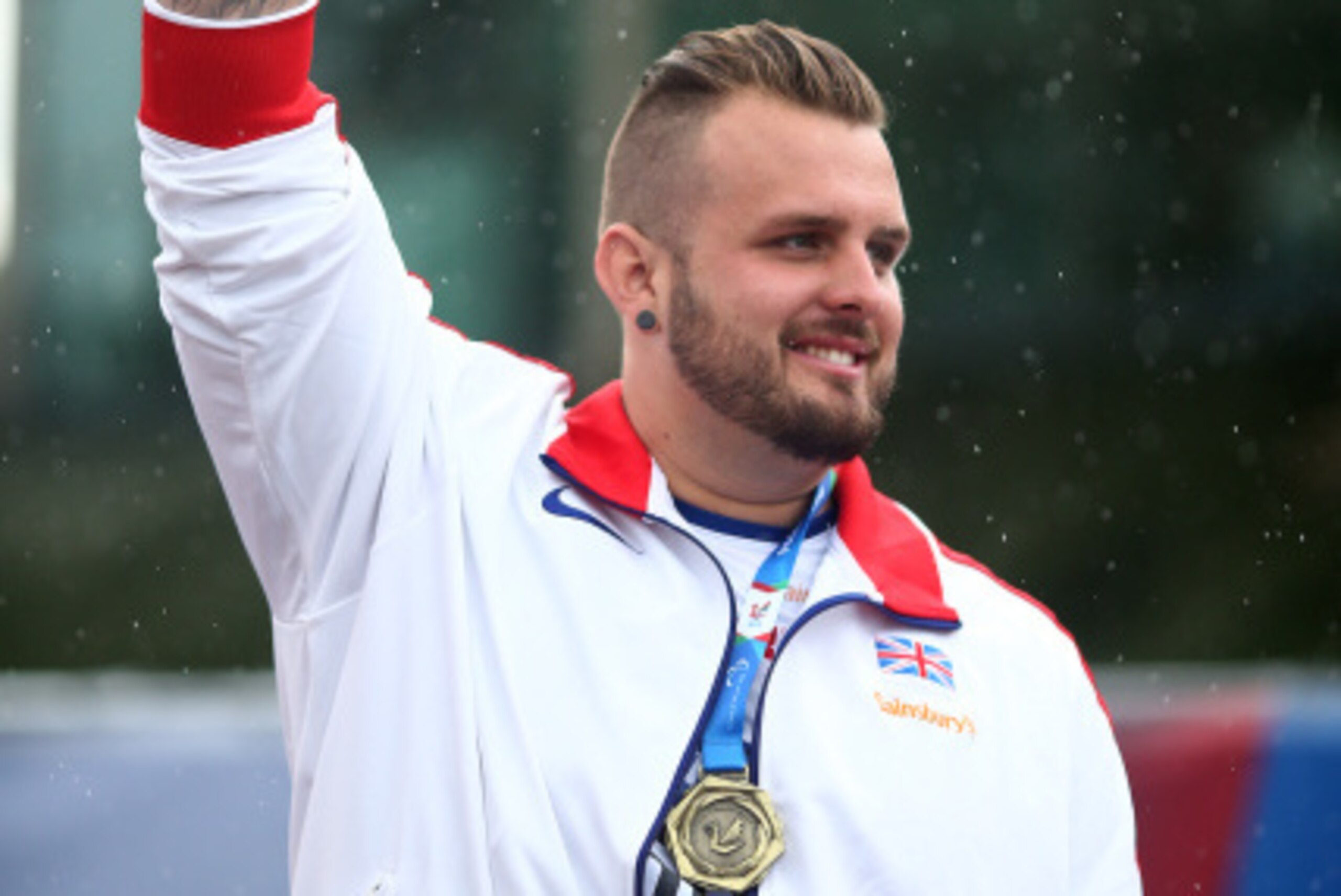 SWANSEA, WALES - AUGUST 21: Aled Davies of Great Britain with his gold medal after winning the mens shot put F42 final during day three of the IPC Athletics European Championships at Swansea University Sports Village on August 21, 2014 in Swansea, Wales. 