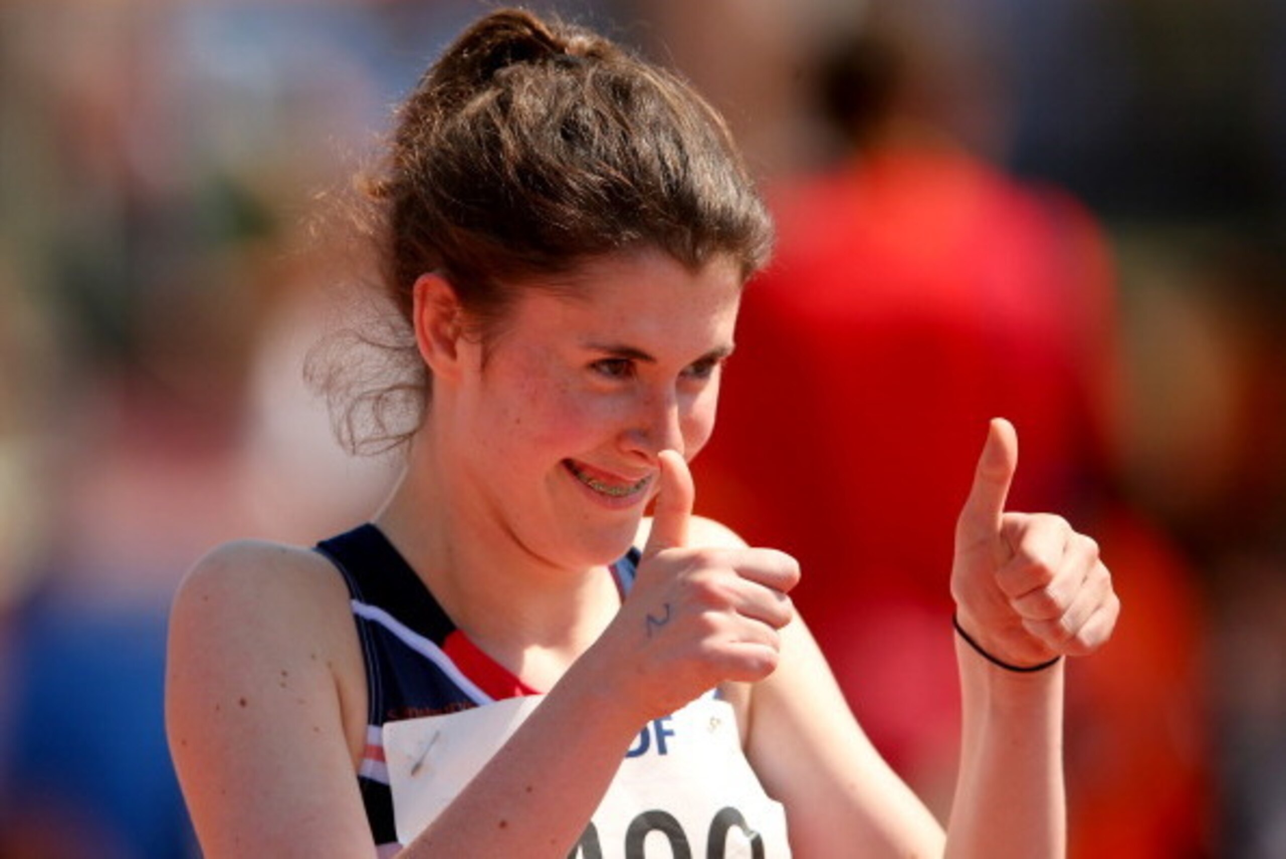 LYON, FRANCE - JULY 23:  A thumbs up from Olivia Breen of Great Britain after her qualification in the Women's 100m T38 semi final during day four of the IPC Athletics World Championships on July 23, 2013 in Lyon, France.  (Photo by Julian Finney/Getty Im