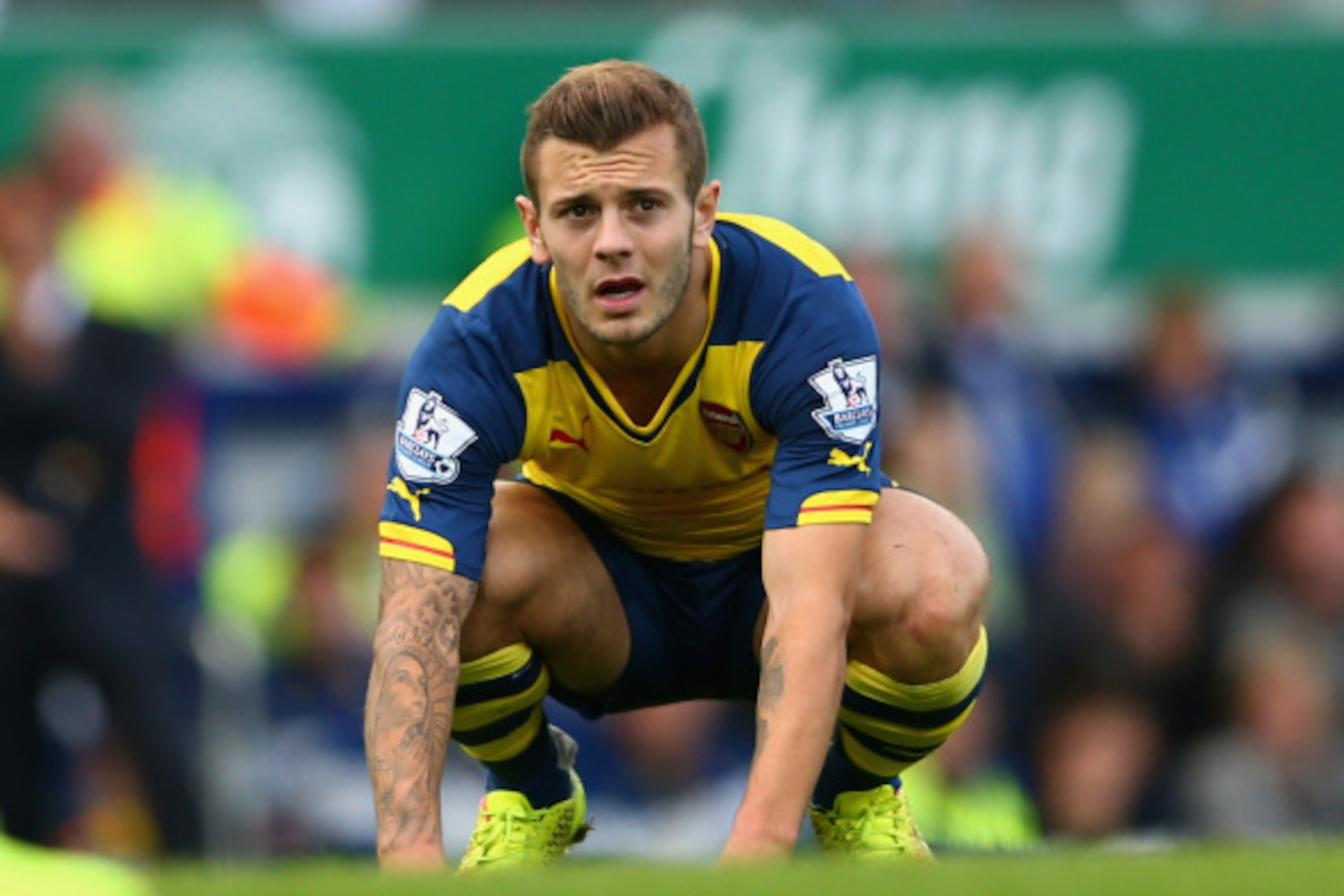 LIVERPOOL, ENGLAND - AUGUST 23:  Jack Wilshere of Arsenal reacts during the Barclays Premier League match between Everton and Arsenal at Goodison Park on August 23, 2014 in Liverpool, England.  (Photo by Clive Brunskill/Getty Images)