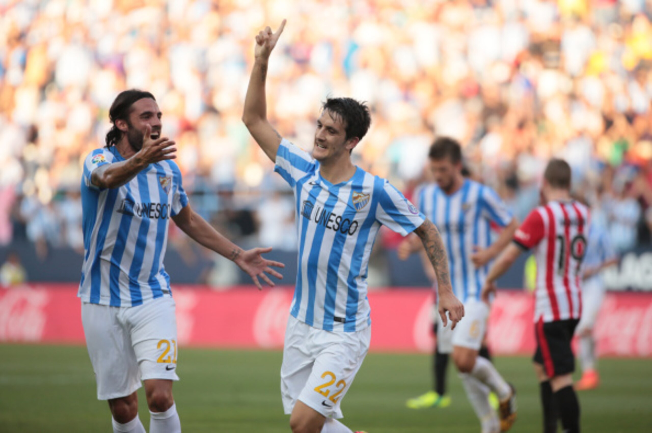 MALAGA, SPAIN - AUGUST 23:  Luis Alberto of Malaga CF (R) celebrates with Sergio Sanchez after scoring against Athletic Club Bilbao at La Rosaleda Stadium on August 23, 2014 in Malaga, Spain.  (Photo by Sergio Camacho/Getty Images)