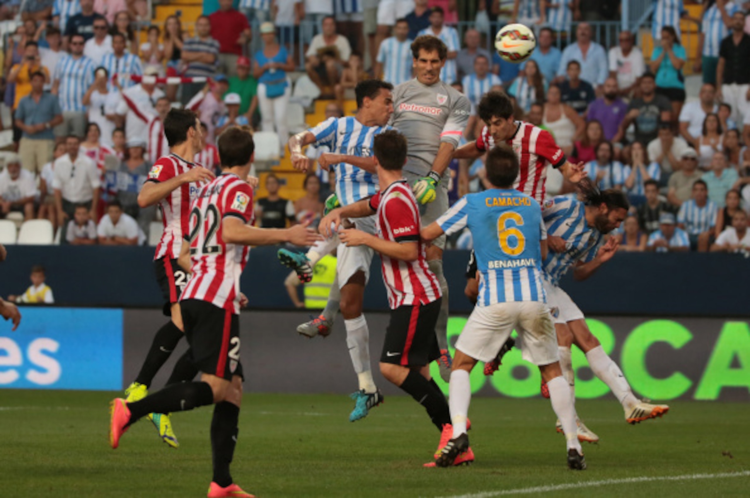 MALAGA, SPAIN - AUGUST 23:Ê Iraizoz of Athletic Club Bilbao (top jump) duels for the ball with Weligton during the La Liga match between Malaga CF and Athletic Club Bilbao at La Rosaleda Stadium on August 23, 2014 in Malaga, Spain.Ê (Photo by Sergio Camac