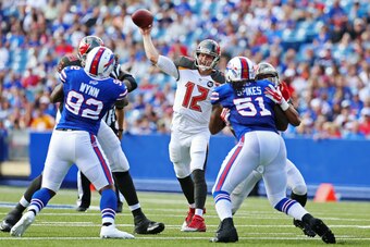 ORCHARD PARK, NY - AUGUST 23: Josh McCown #12 of the Tampa Bay Buccaneers throws against the Buffalo Bills during the first quarter at Ralph Wilson Stadium on August 23, 2014 in Orchard Park, New York. (Photo by Vaughn Ridley/Getty Images)