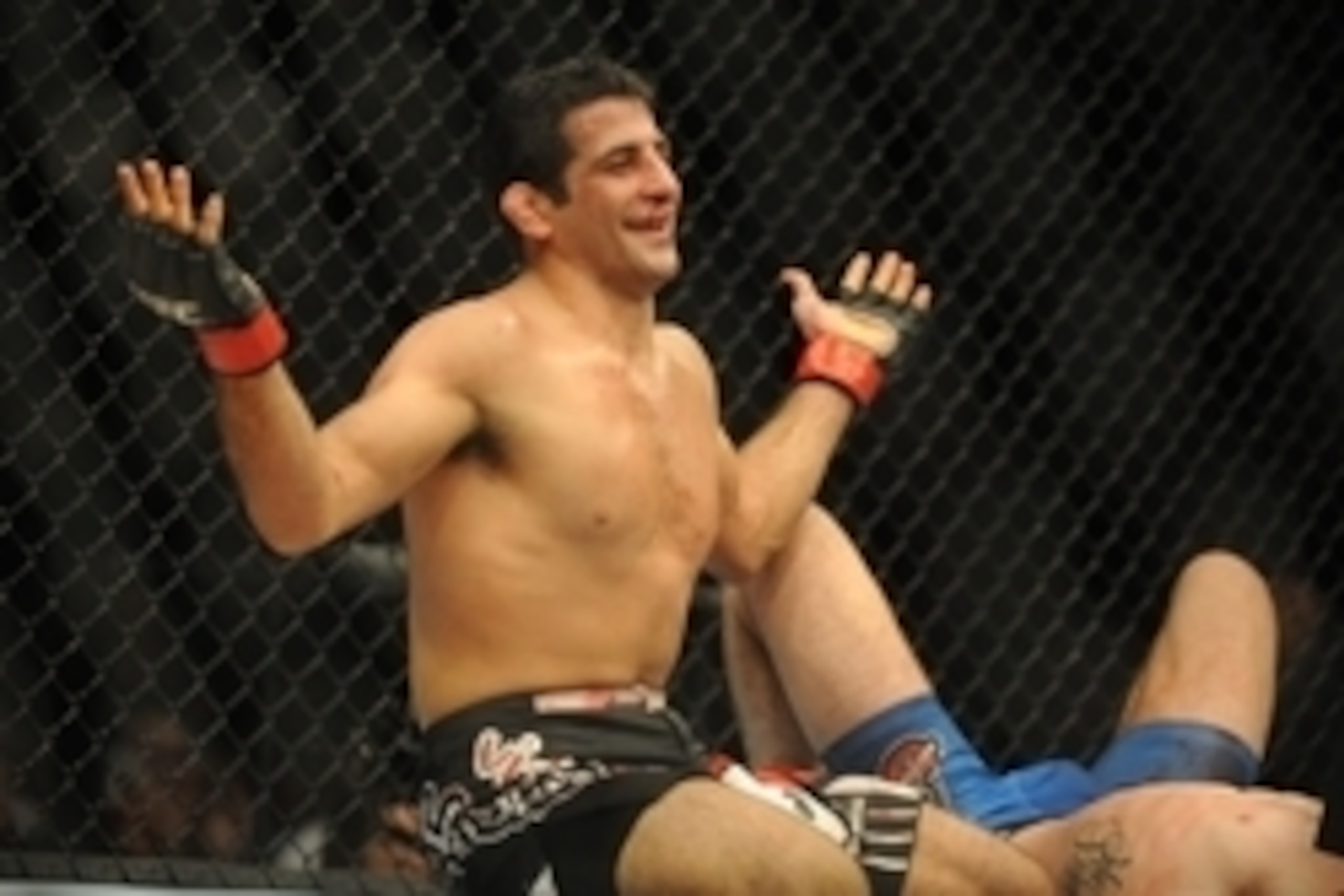 Aug 23, 2014; Tulsa, OK, USA; Beneil Dariush (red gloves) fights Tony Martin (blue gloves) in a Lightweight Division Bout at BOK Center. Mandatory Credit: Mark D. Smith-USA TODAY Sports