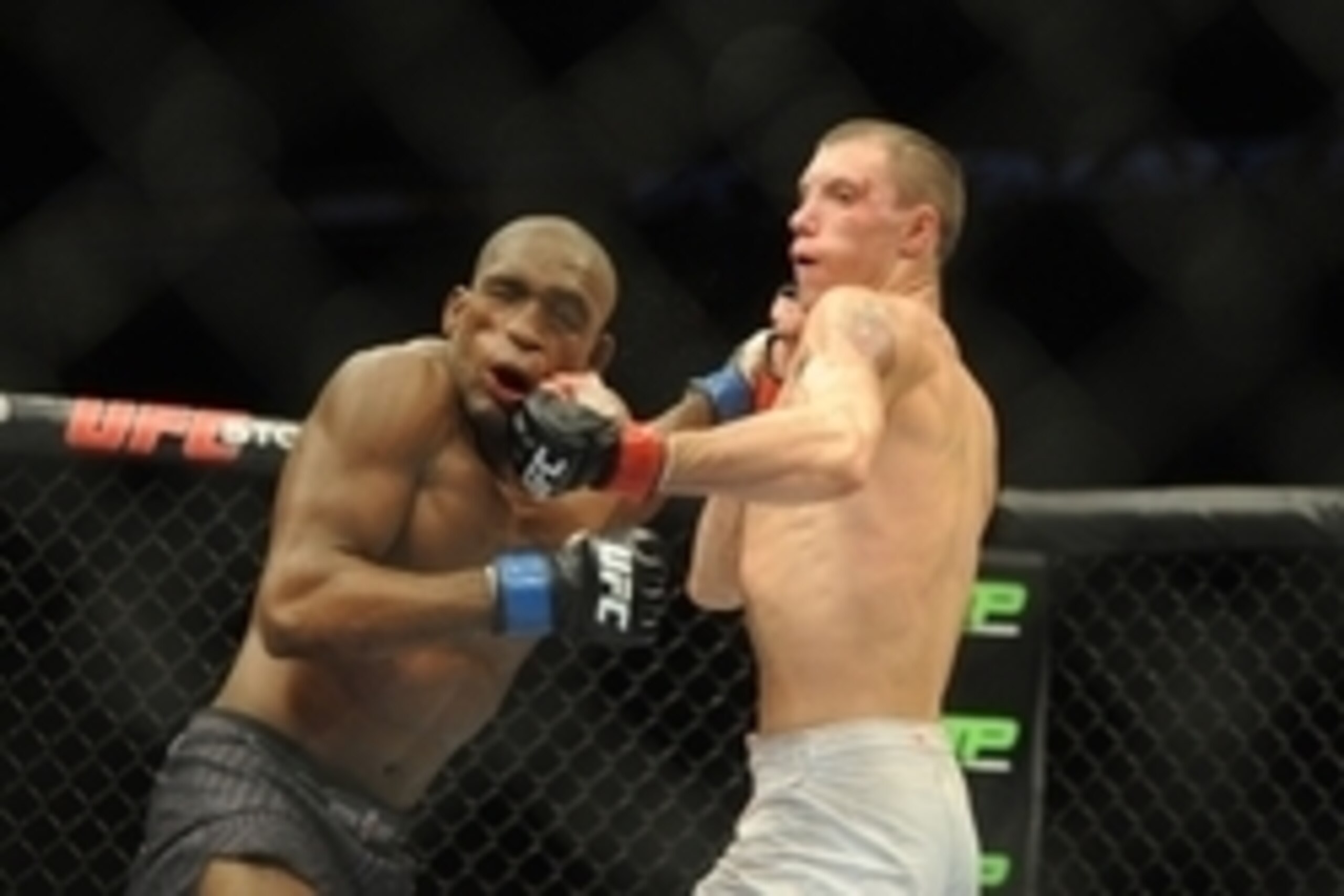 Aug 23, 2014; Tulsa, OK, USA; James Vick (red gloves) fights Valmir Lazaro (blue gloves) in a Lightweight Bout at BOK Center. Mandatory Credit: Mark D. Smith-USA TODAY Sports