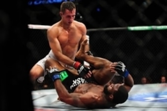 Jun 14, 2014; Vancouver, British Columbia, Canada; Rory MacDonald (red) fights Tyron Woodley (blue) during the Welterweigtht bout at UFC 174 at Rogers Arena. Rory MacDonald defeats Tyron Woodley via unanimous decision. Mandatory Credit: Anne-Marie Sorvin Jun 14, 2014; Vancouver, British Columbia, Canada; Rory MacDonald (red) fights Tyron Woodley (blue) during the Welterweigtht bout at UFC 174 at Rogers Arena. Rory MacDonald defeats Tyron Woodley via unanimous decision. Mandatory Credit: Anne-Marie Sorvin