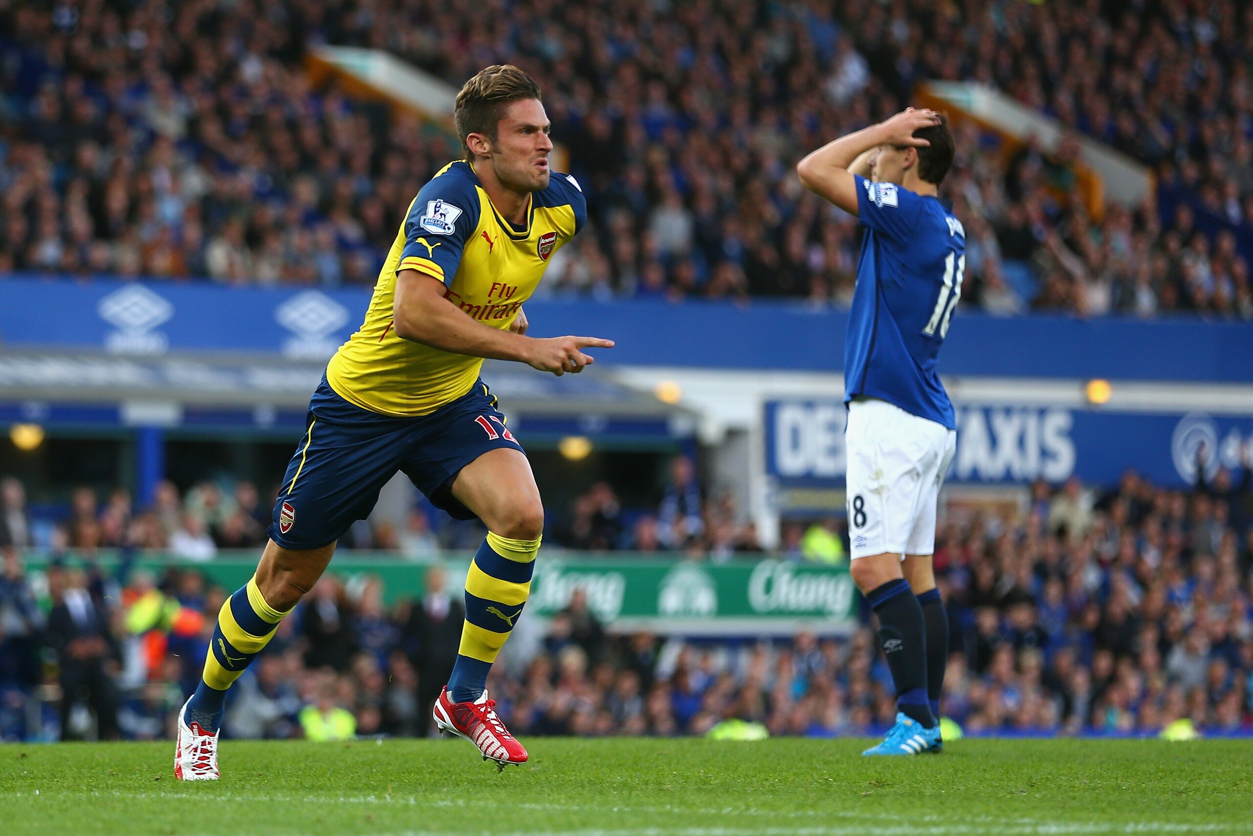 LIVERPOOL, ENGLAND - AUGUST 23:  Olivier Giroud of Arsenal celebrates scoring his team's second goal during the Barclays Premier League match between Everton and Arsenal at Goodison Park on August 23, 2014 in Liverpool, England.  (Photo by Clive Brunskill