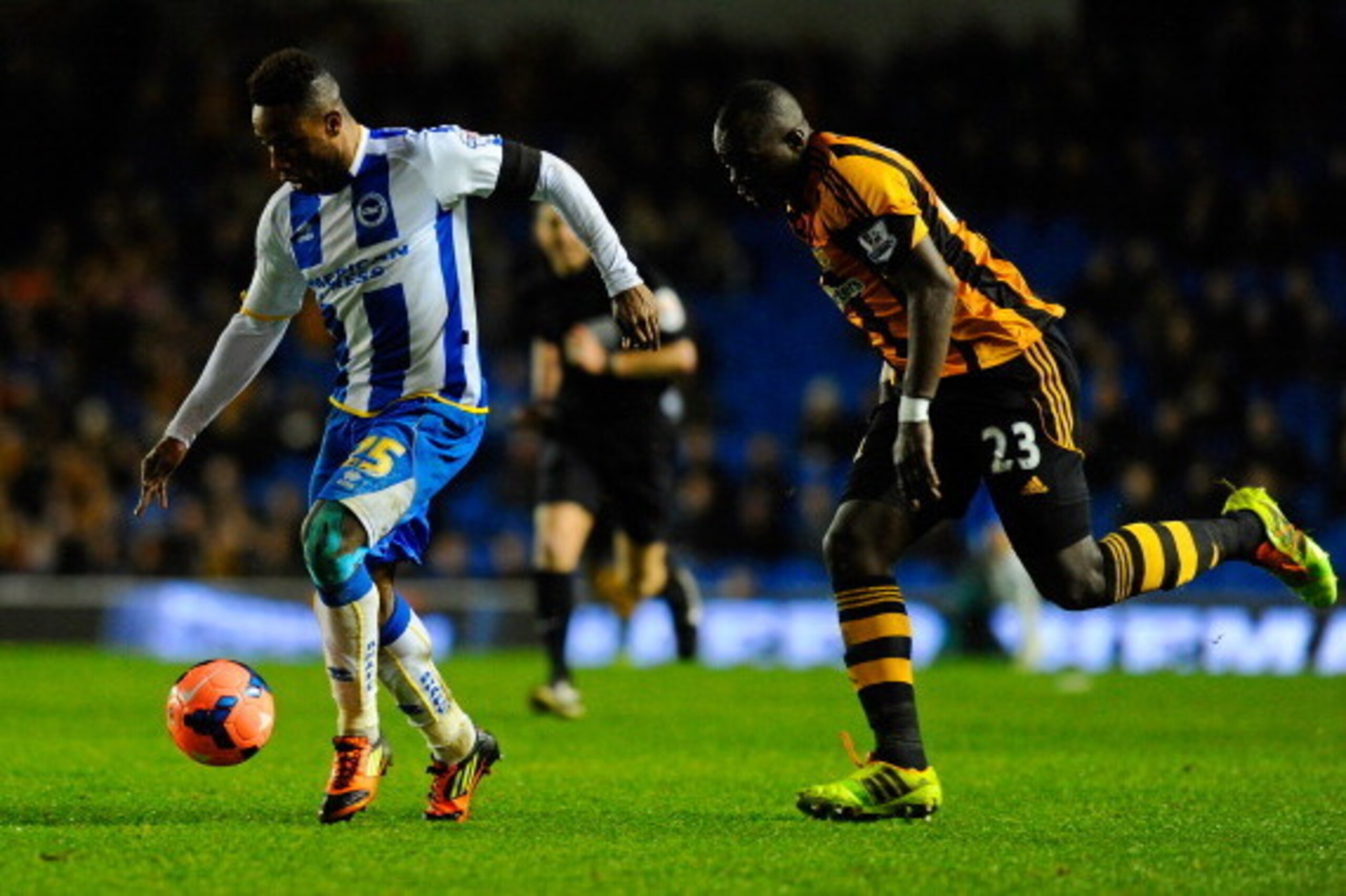 BRIGHTON, ENGLAND - FEBRUARY 17: Kazenga LuaLua of Brighton is closed down by Abdoulaye Faye of Hull City during the FA Cup fifth round match between Brighton & Hove Albion and Hull City at Amex Stadium on February 17, 2014 in Brighton, England. (Photo BRIGHTON, ENGLAND - FEBRUARY 17: Kazenga LuaLua of Brighton is closed down by Abdoulaye Faye of Hull City during the FA Cup fifth round match between Brighton & Hove Albion and Hull City at Amex Stadium on February 17, 2014 in Brighton, England. (Photo