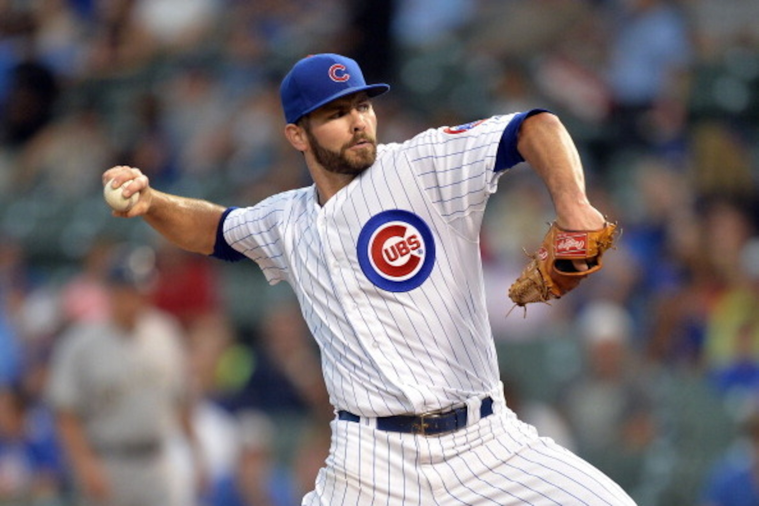 CHICAGO, IL - AUGUST 11:  Starting pitcher Jake Arrieta #49 of the Chicago Cubs delivers a pitch during the first inning against the Milwaukee Brewers at Wrigley Field on August 11, 2014 in Chicago, Illinois.  (Photo by Brian Kersey/Getty Images)
