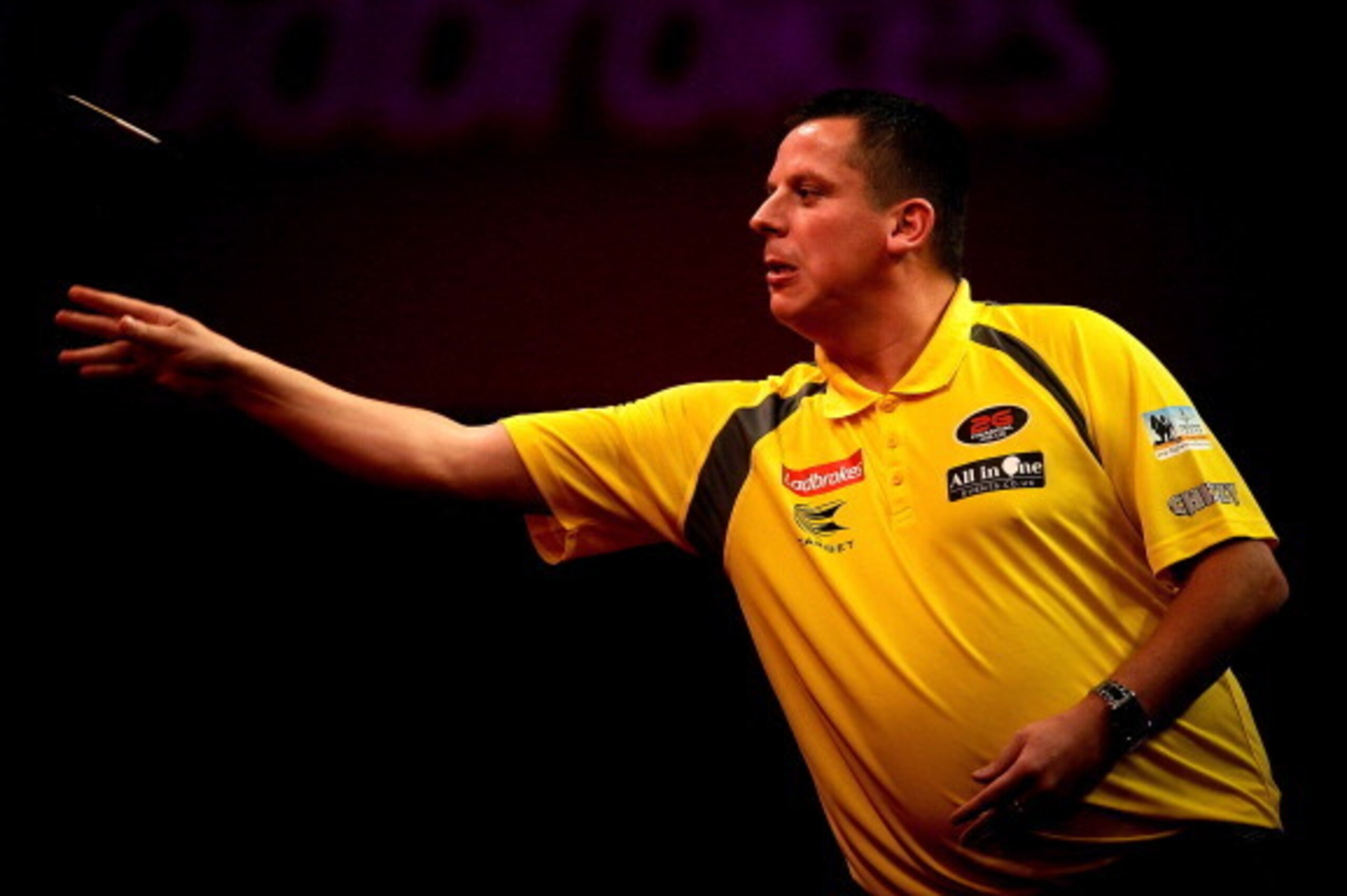 LONDON, ENGLAND - DECEMBER 15: Dave Chisnall of England in action during day three of the Ladbrokes.com World Darts Championships at Alexandra Palace on December 15, 2013 in London, England.  (Photo by Ben Hoskins/Getty Images)