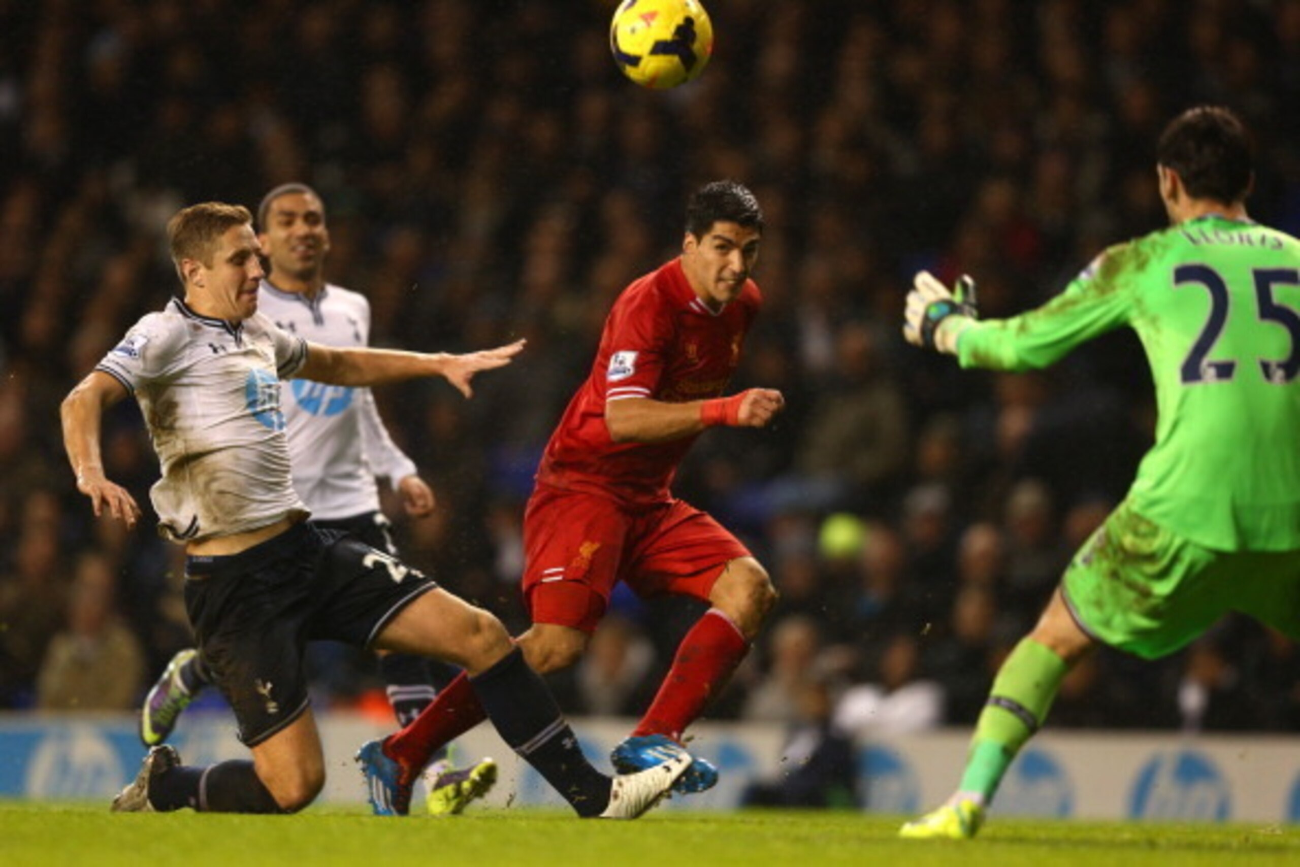 LONDON, ENGLAND - DECEMBER 15:  Luis Suarez of Liverpool scores their fourth goal during the Barclays Premier League match between Tottenham Hotspur and Liverpool at White Hart Lane on December 15, 2013 in London, England. (Photo by Paul Gilham/Getty Imag