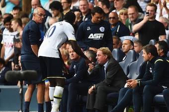 LONDON, ENGLAND - AUGUST 24:  Emmanuel Adebayor of Spurs shakes hands with Harry Redknapp, the QPR manager during the Barclays Premier League match between Tottenham Hotspur and Queens Park Rangers at White Hart Lane on August 24, 2014 in London, England.