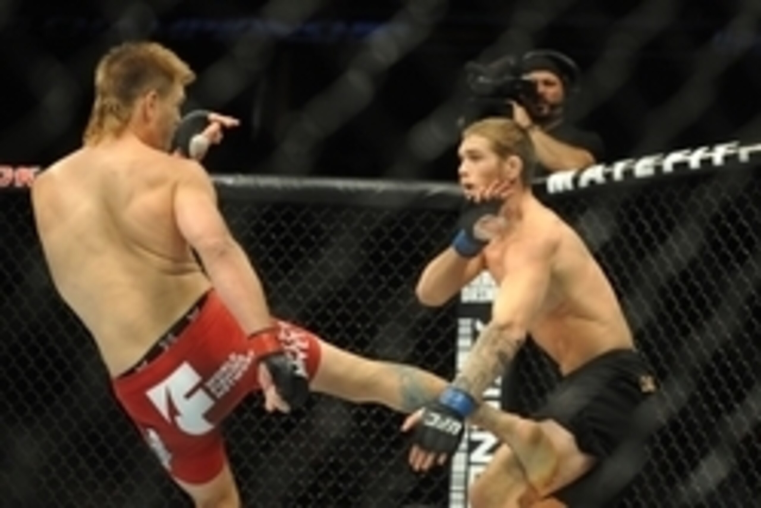 Aug 23, 2014; Tulsa, OK, USA; Mike Pyle (red gloves) fights Jordan Mein (blue gloves) in a Welterweight Bout at BOK Center. Mandatory Credit: Mark D. Smith-USA TODAY Sports