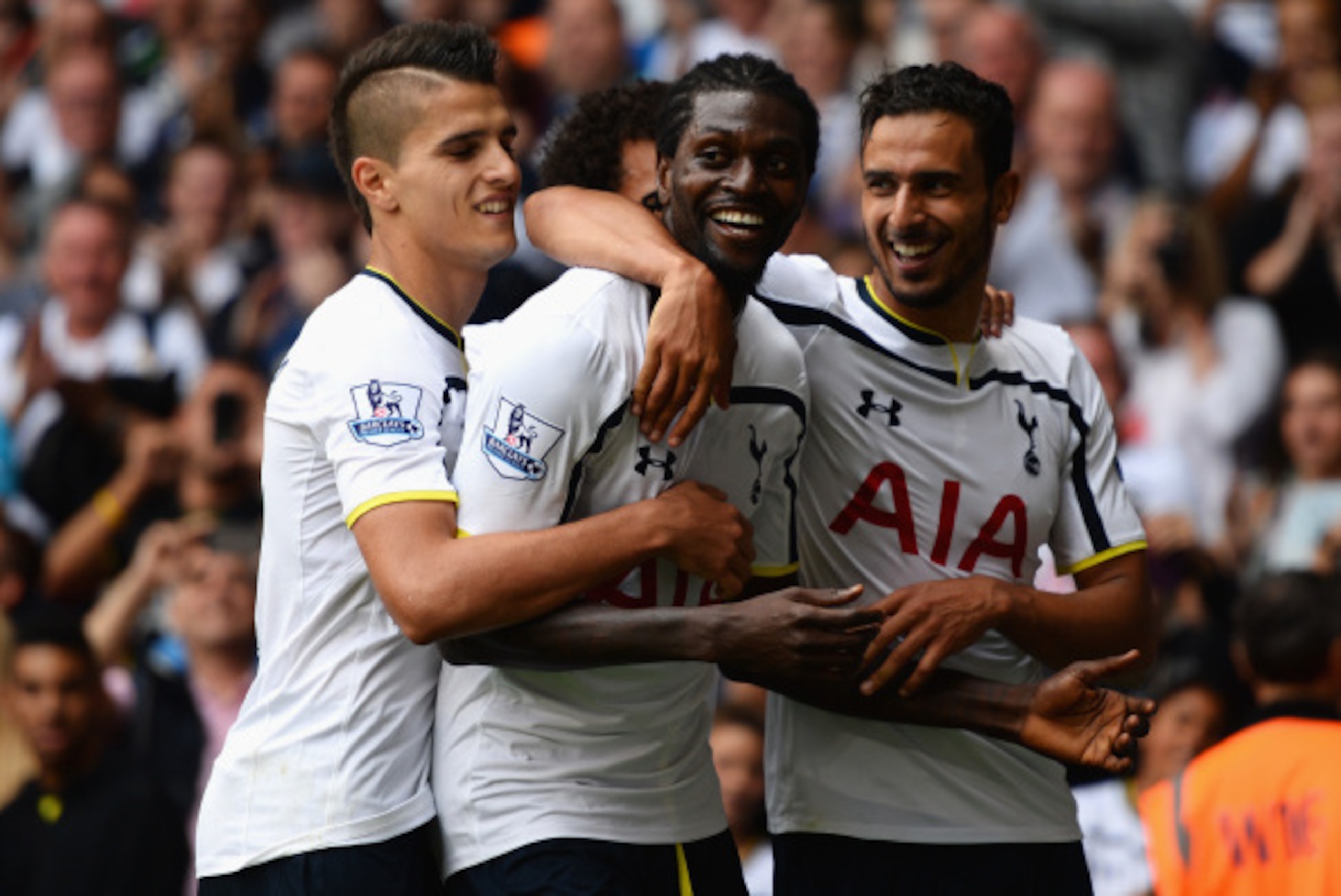LONDON, ENGLAND - AUGUST 24:  Emmanuel Adebayor of Spurs celebrates his goal with team mates during the Barclays Premier League match between Tottenham Hotspur and Queens Park Rangers at White Hart Lane on August 24, 2014 in London, England.  (Photo by Ja