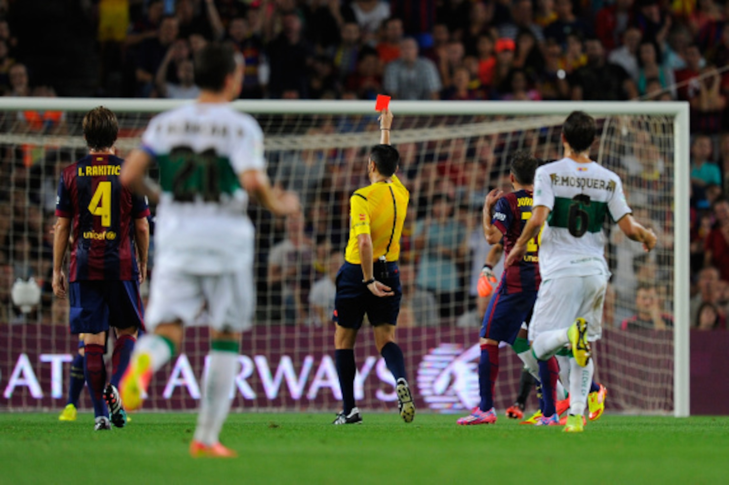 BARCELONA, SPAIN - AUGUST 24:  Referee Fernando Teixeira shows the red card to Javier Mascherano (unseen) of FC Barcelona during the La Liga match between FC Barcelona and Elche FC at Camp Nou stadium on August 24, 2014 in Barcelona, Spain.  (Photo by Den