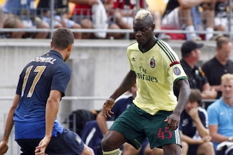 PITTSBURGH, PA - JULY 27:  Mario Balotelli #45 of AC Milan handles the ball against Jack Rodwell #17 of Manchester City during International Champions Cup 2014 at Heinz Field on July 27, 2014 in Pittsburgh, Pennsylvania.  (Photo by Justin K. Aller/Getty I
