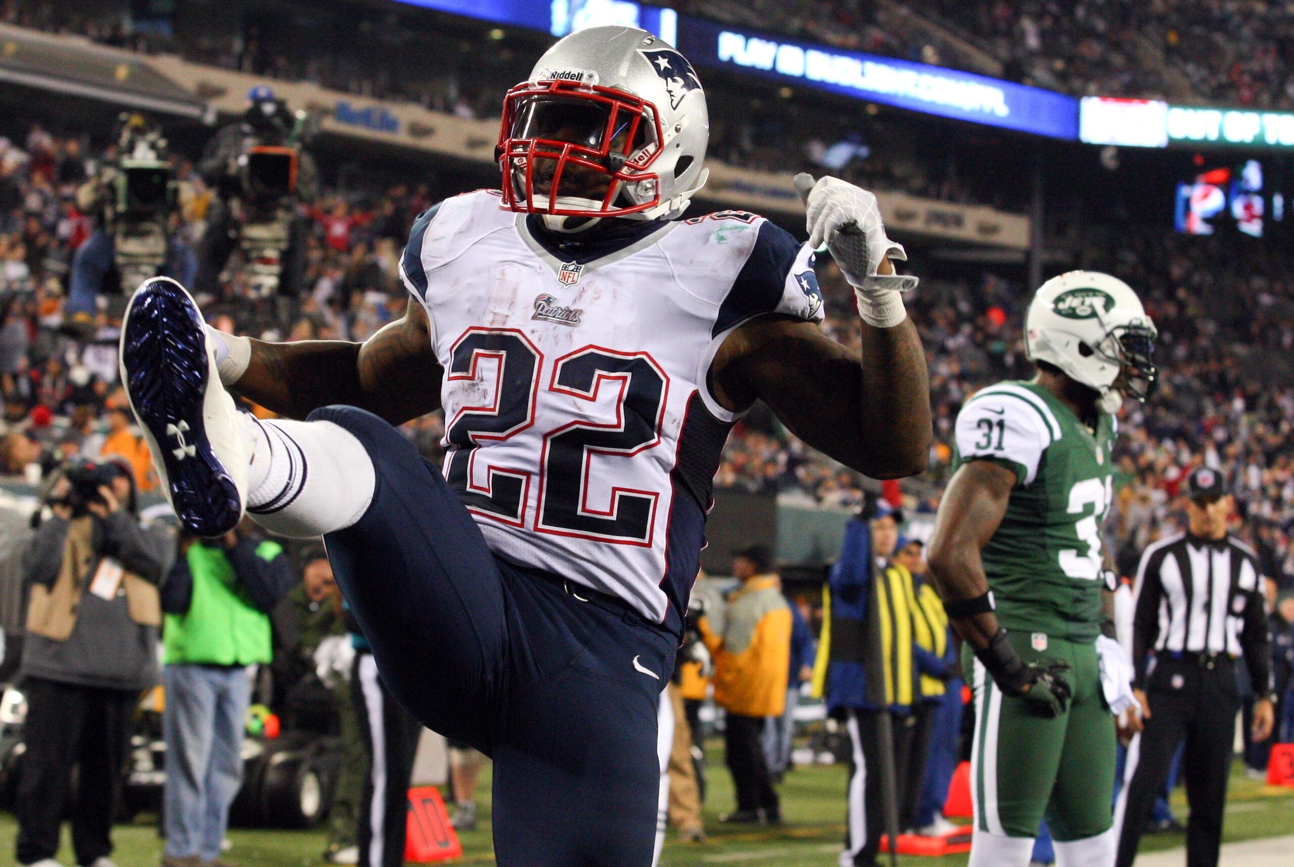Nov 22, 2012; East Rutherford, NJ, USA; New England Patriots running back Stevan Ridley (22) celebrates his touchdown run against the New York Jets during the second half on Thanksgiving at Metlife Stadium. Patriots defeated the Jets 49-19.  Mandatory Cre