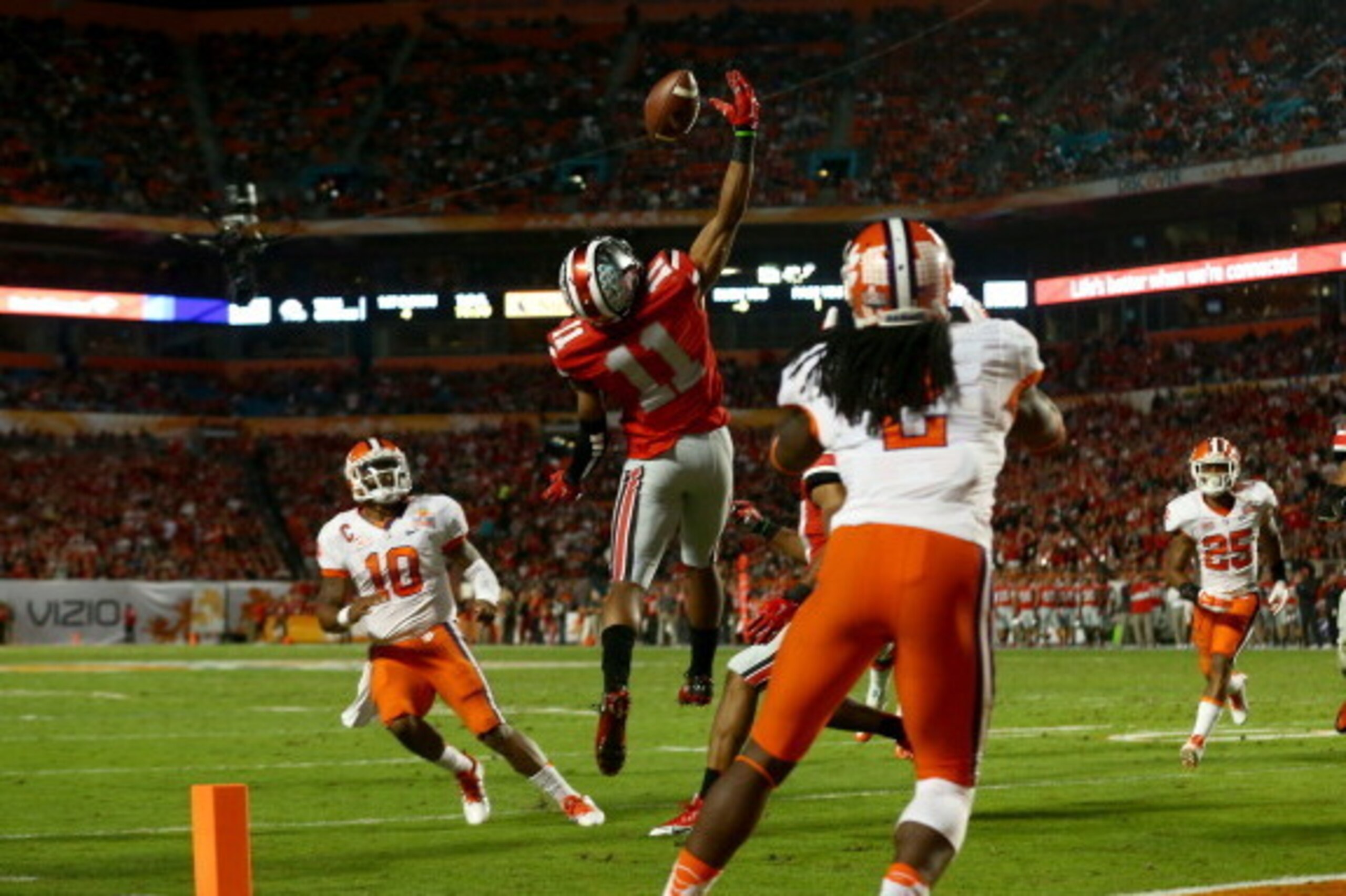 MIAMI GARDENS, FL - JANUARY 03: Vonn Bell #11 of the Ohio State Buckeyes intercepts a pass thrown by Tajh Boyd #10 of the Clemson Tigers in the second quarter during the Discover Orange Bowl at Sun Life Stadium on January 3, 2014 in Miami Gardens, Florida