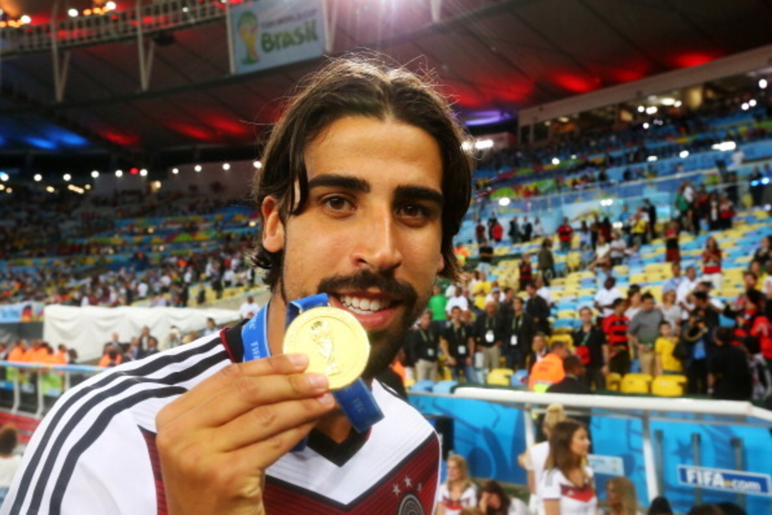 RIO DE JANEIRO, BRAZIL - JULY 13: Sami Khedira of Germany celebrates with his medal after defeating Argentina 1-0 in extra-time during the 2014 FIFA World Cup Brazil Final match between Germany and Argentina at Maracana on July 13, 2014 in Rio de Janeiro RIO DE JANEIRO, BRAZIL - JULY 13: Sami Khedira of Germany celebrates with his medal after defeating Argentina 1-0 in extra-time during the 2014 FIFA World Cup Brazil Final match between Germany and Argentina at Maracana on July 13, 2014 in Rio de Janeiro