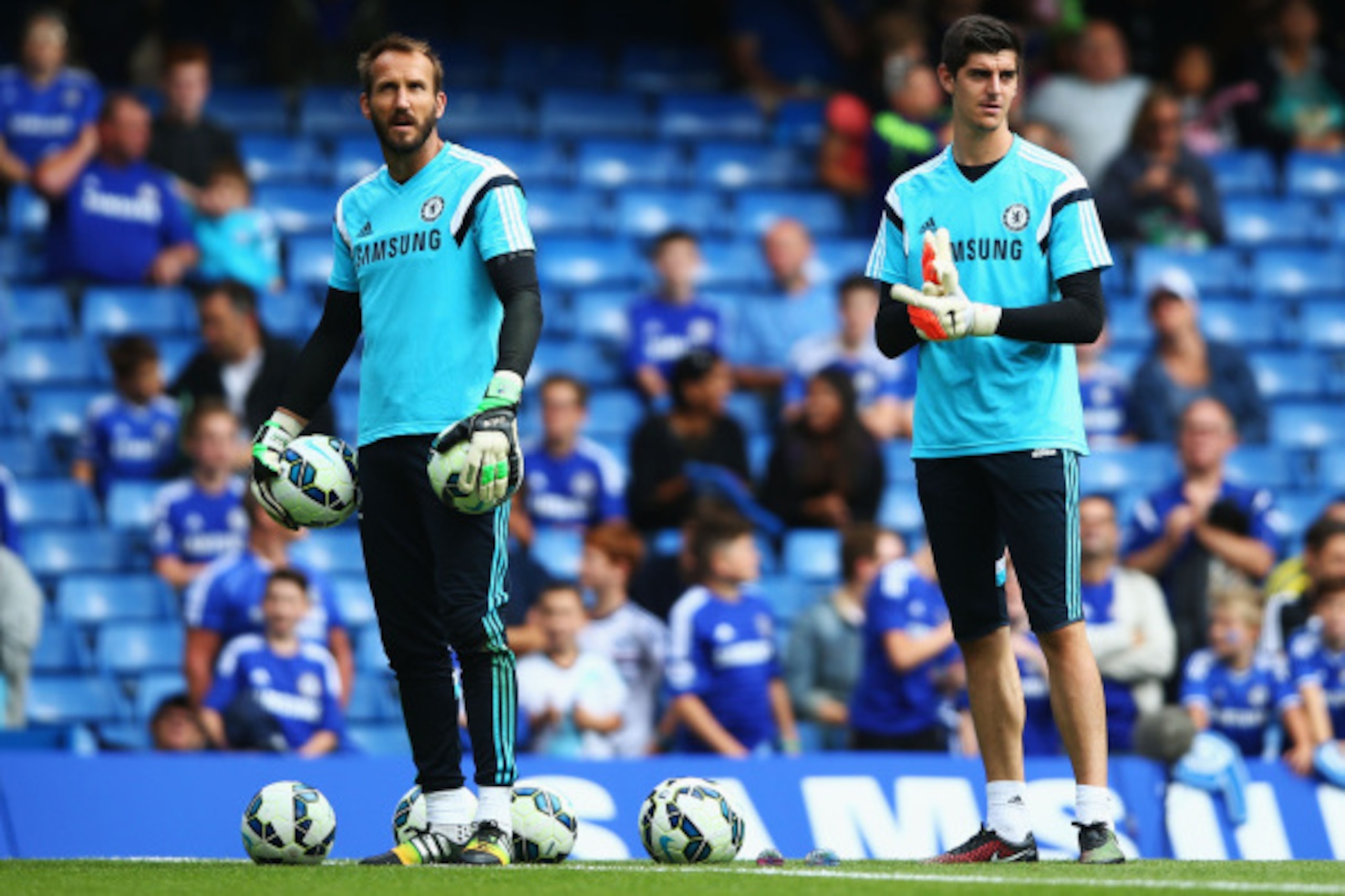 LONDON, ENGLAND - AUGUST 23:  Mark Schwarzer (L) and Thibaut Courtois of Chelsea prior to the Barclays Premier League match between Chelsea and Leicester City at Stamford Bridge on August 23, 2014 in London, England.  (Photo by Paul Gilham/Getty Images)
