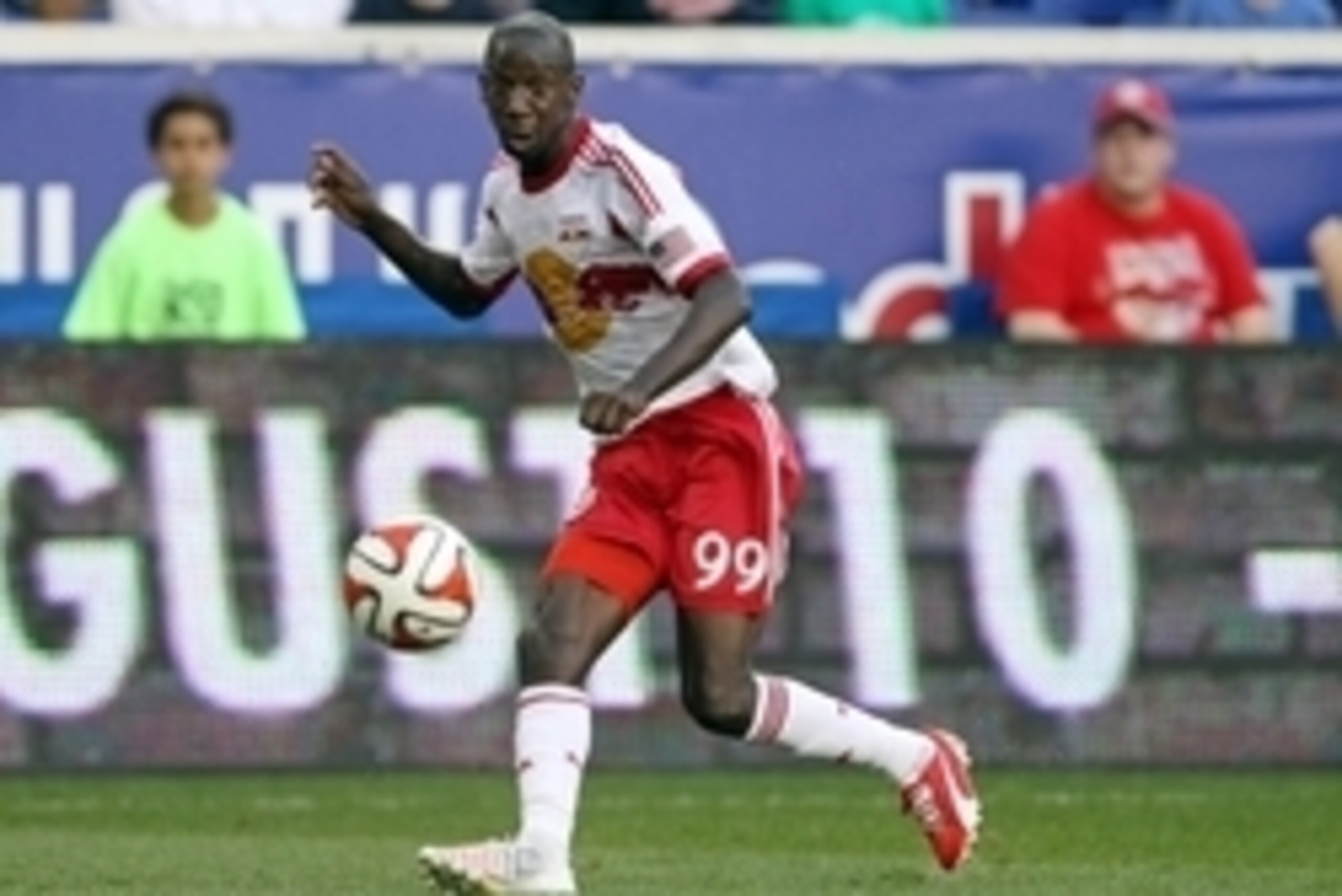 Aug 2, 2014; Harrison, NJ, USA; New York Red Bulls forward Bradley Wright-Phillips (99) passes the ball against the New England Revolution during the first half at Red Bull Arena. Mandatory Credit: Adam Hunger-USA TODAY Sports Aug 2, 2014; Harrison, NJ, USA; New York Red Bulls forward Bradley Wright-Phillips (99) passes the ball against the New England Revolution during the first half at Red Bull Arena. Mandatory Credit: Adam Hunger-USA TODAY Sports