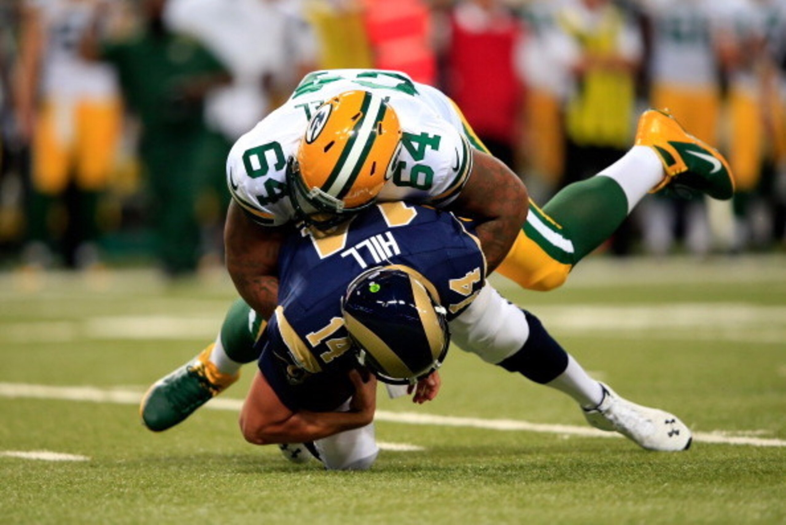 ST LOUIS, MO - AUGUST 16: Mike Pennel #64 of the Green Bay Packers sacks quarterback Shaun Hill #14 of the St. Louis Rams during the preseason game at Edward Jones Dome on August 16, 2014 in St Louis, Missouri. (Photo by Jamie Squire/Getty Images) ST LOUIS, MO - AUGUST 16: Mike Pennel #64 of the Green Bay Packers sacks quarterback Shaun Hill #14 of the St. Louis Rams during the preseason game at Edward Jones Dome on August 16, 2014 in St Louis, Missouri. (Photo by Jamie Squire/Getty Images)