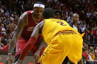 MIAMI, FL - DECEMBER 14:  LeBron James #6 of the Miami Heat drives on Kyrie Irving #2 of the Cleveland Cavaliers during a game  at American Airlines Arena on December 14, 2013 in Miami, Florida. NOTE TO USER: User expressly acknowledges and agrees that, b